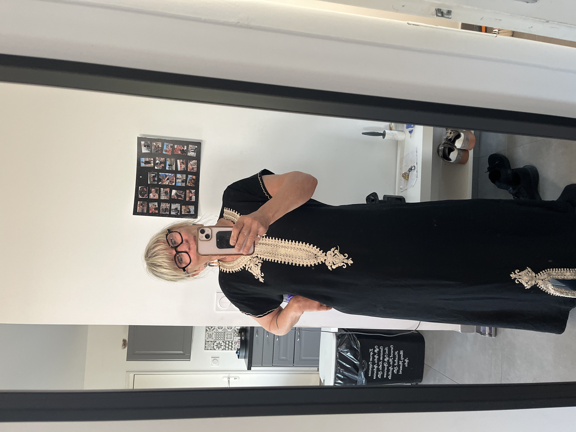 Woman takes mirror selfie in embroidered dress in Chambœuf