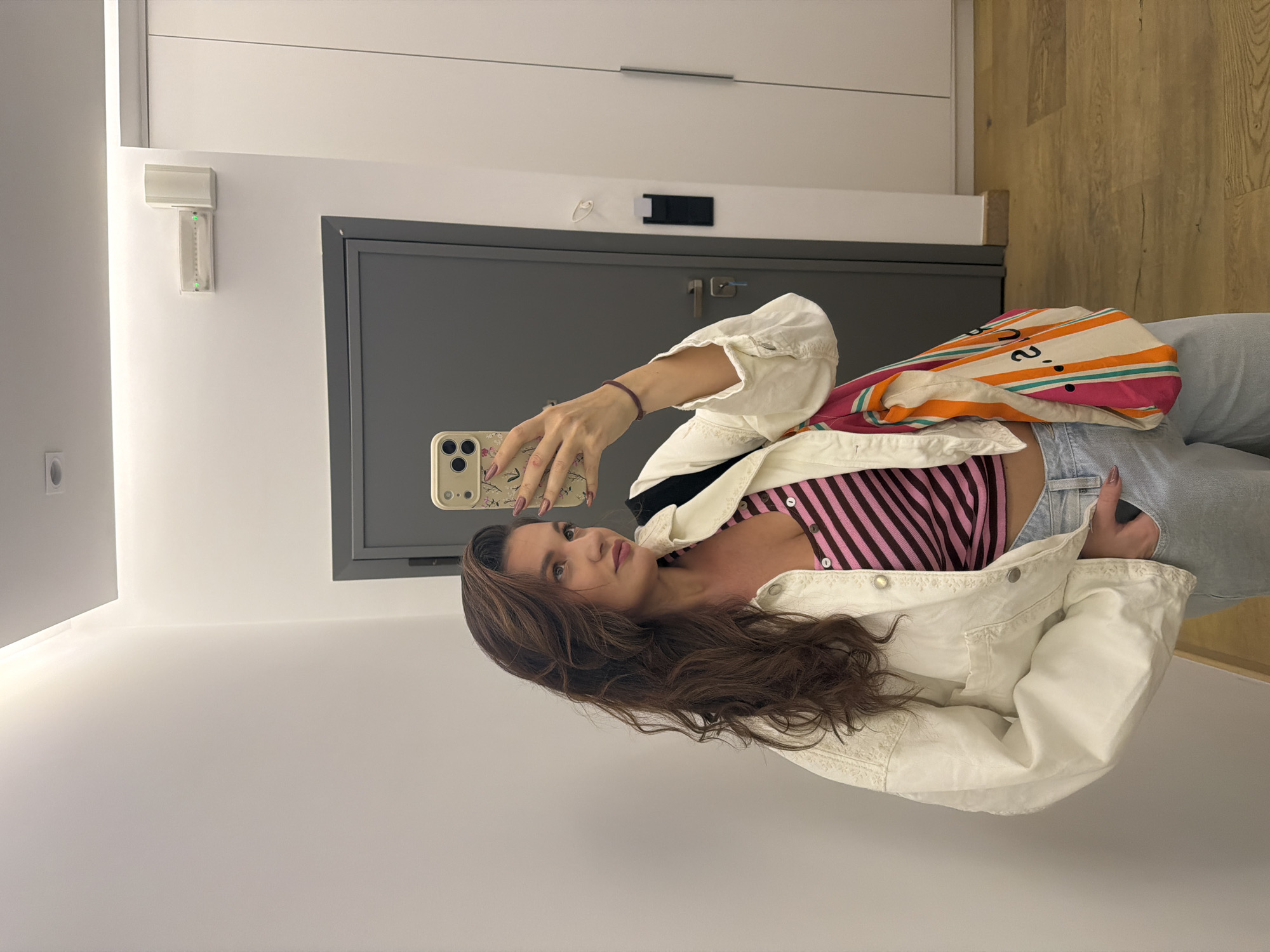 Woman takes selfies in Athens dressing room