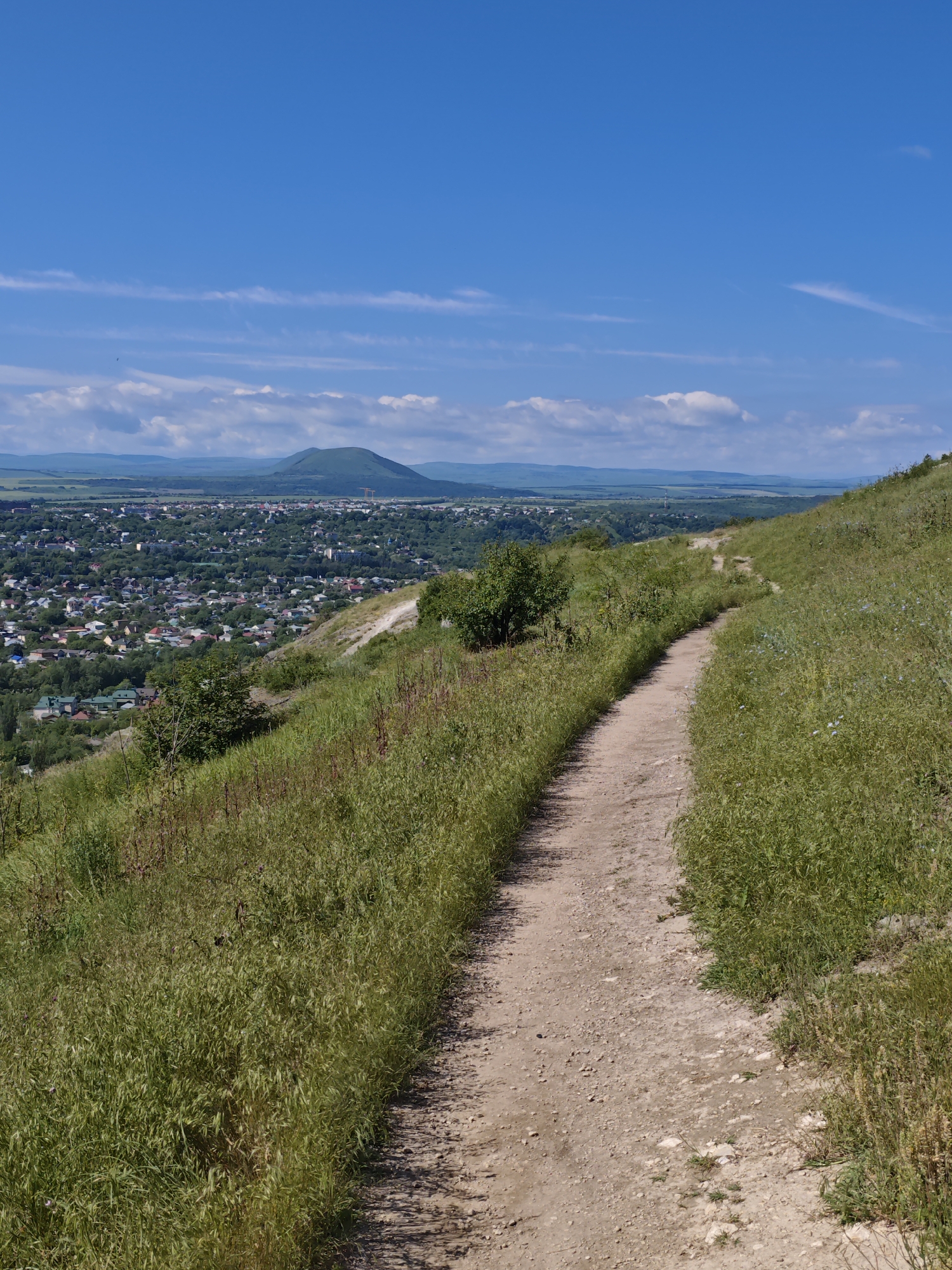 Morning hillside photography session captures Pyatigorsk cityscape and wildflowers