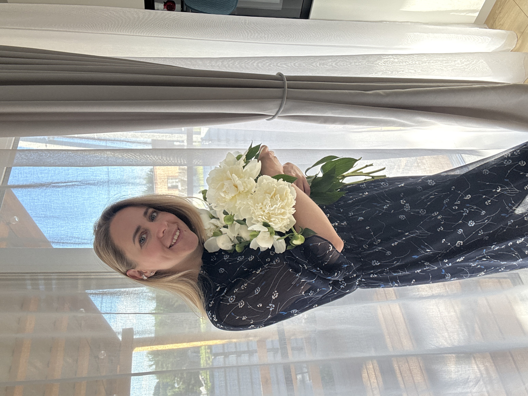 White peonies and a floral dress, photographed at home in Chaikovsky