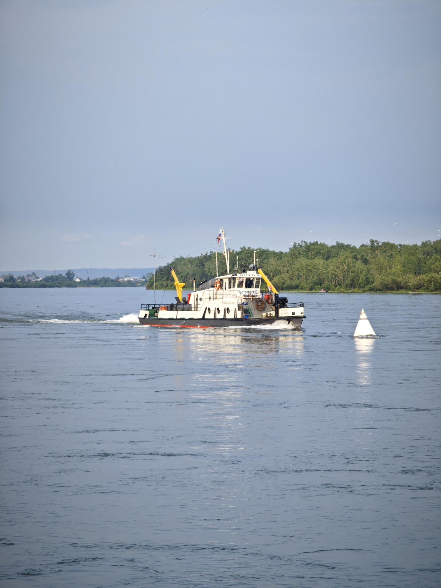 Cargo vessel and shipyard activity on the Yenisei River