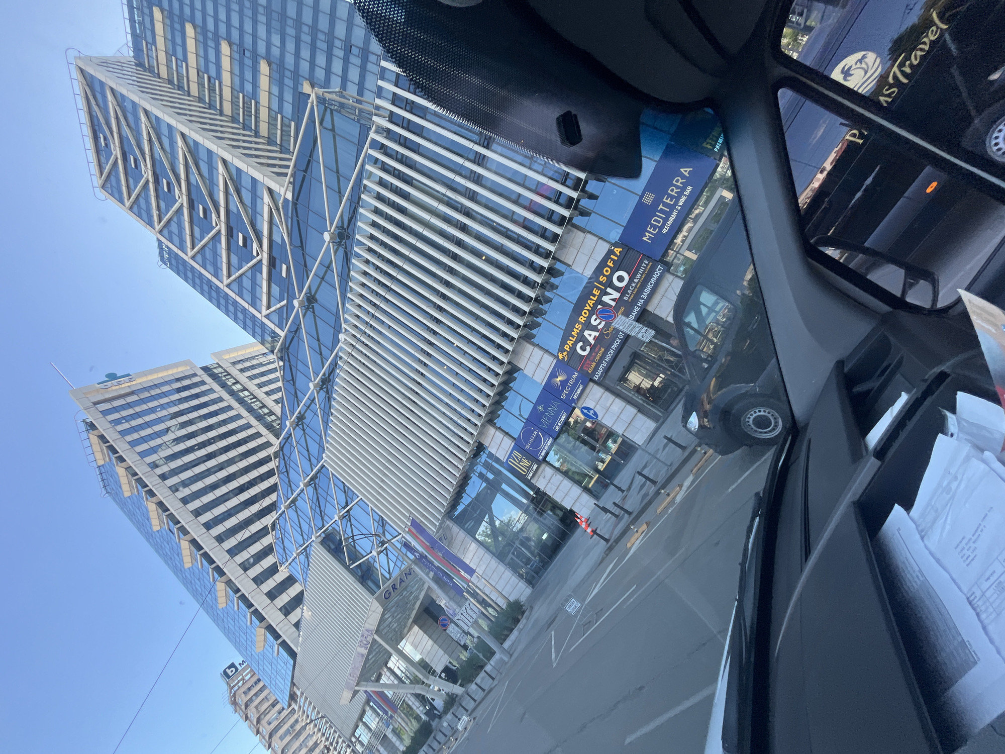 Morning drive through modern city with highways and skyscrapers