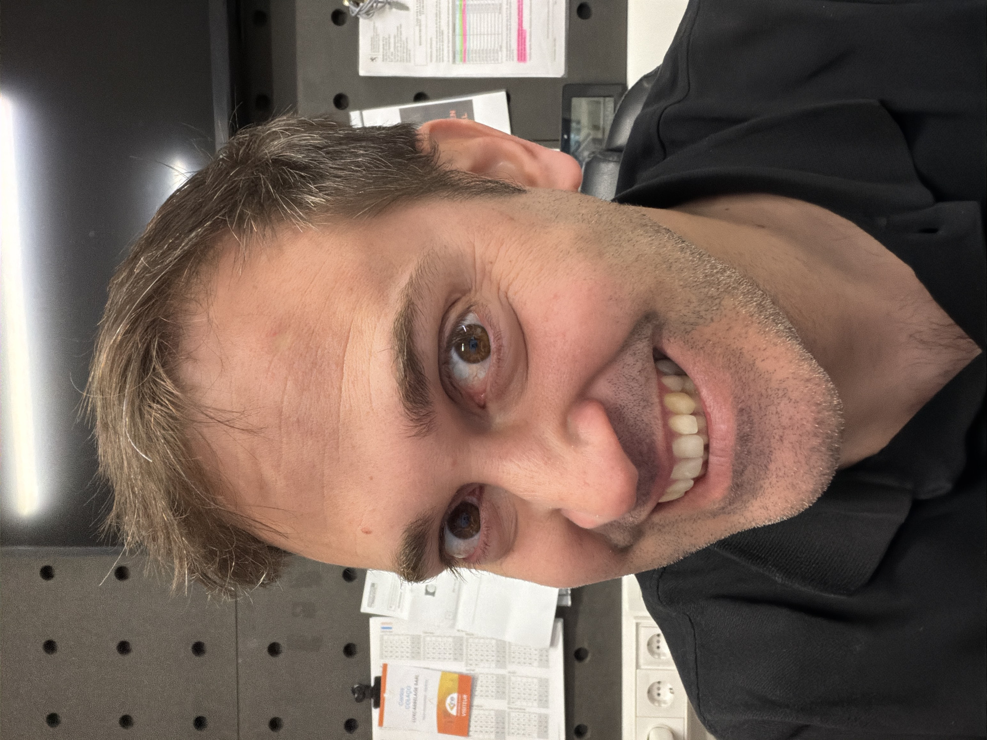 Man photographed smiling at workplace in Pétange, Luxembourg