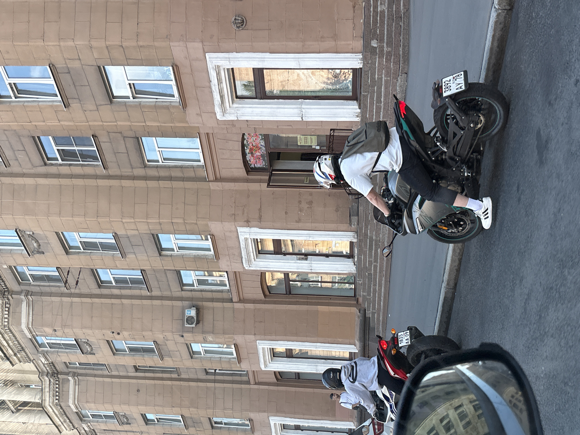 Motorcyclist observed on Saint Petersburg street during midday traffic