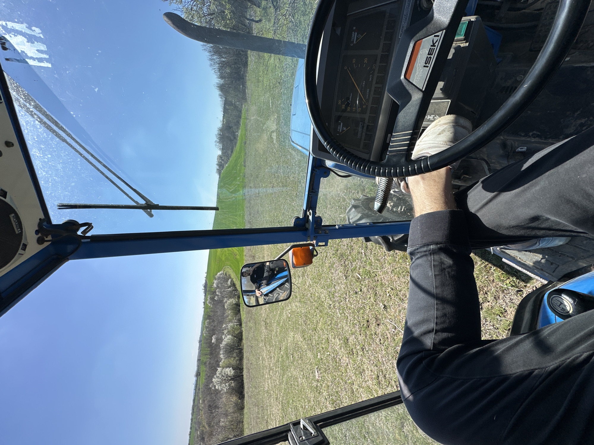 Tractor operator documents rural view in Bulgarian countryside