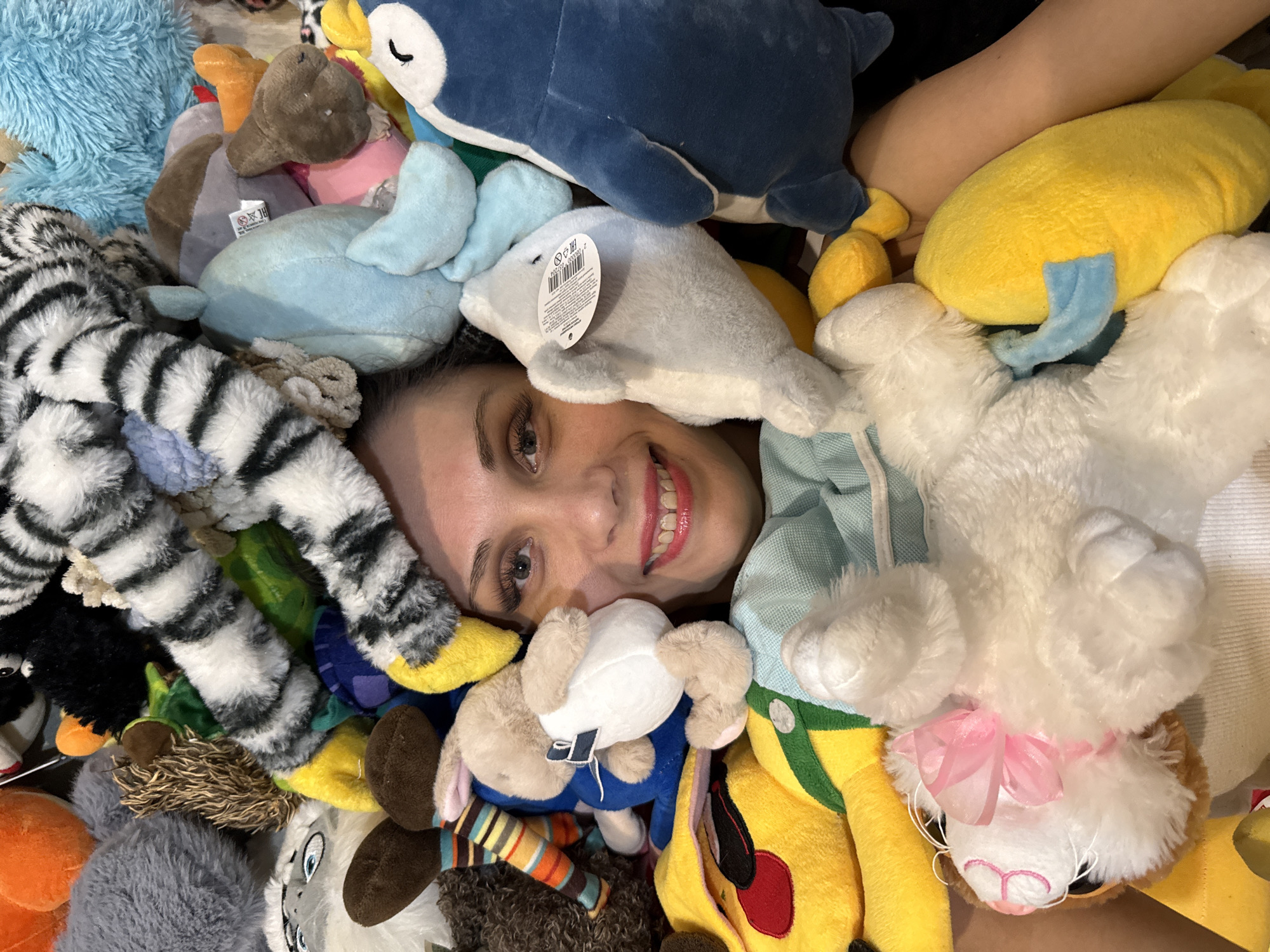 Woman poses with stuffed animal collection in Bor, Russia