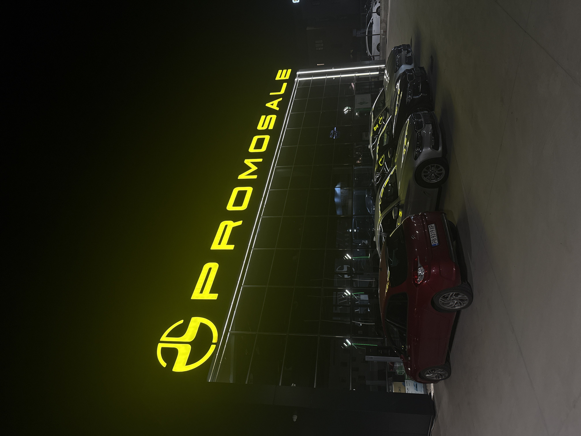Car dealership operates under night lights in Plovdiv