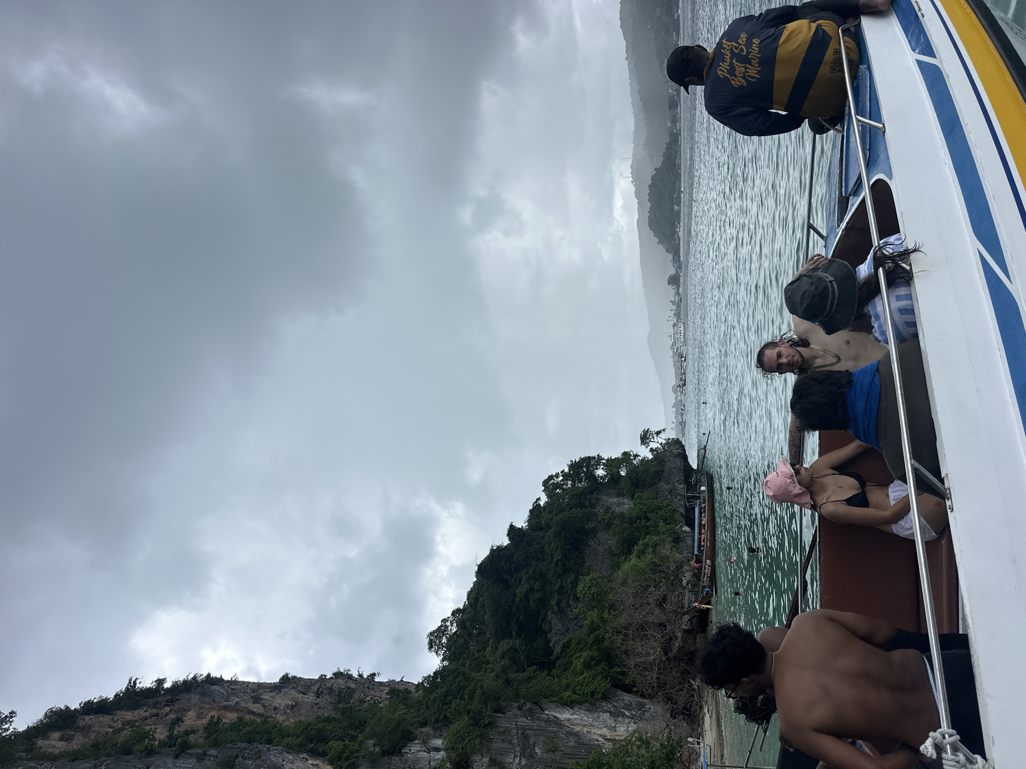 Boat tour through Ao Nang's cloudy karst island waters