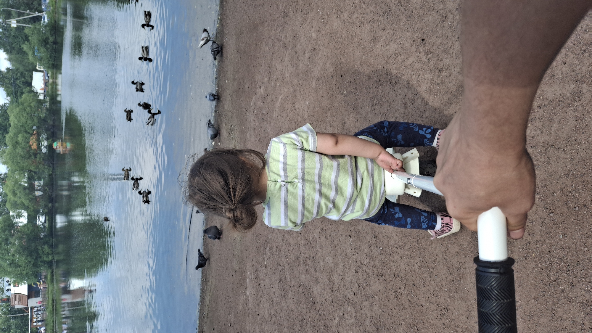 Child plays with toys near waterfront in Saint Petersburg