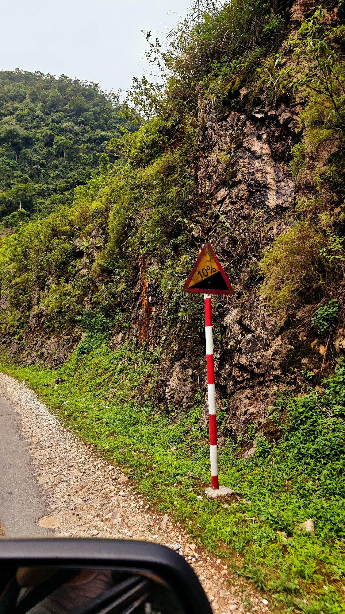 Regular traffic flows through Cán Tỷ Commune road Vietnam
