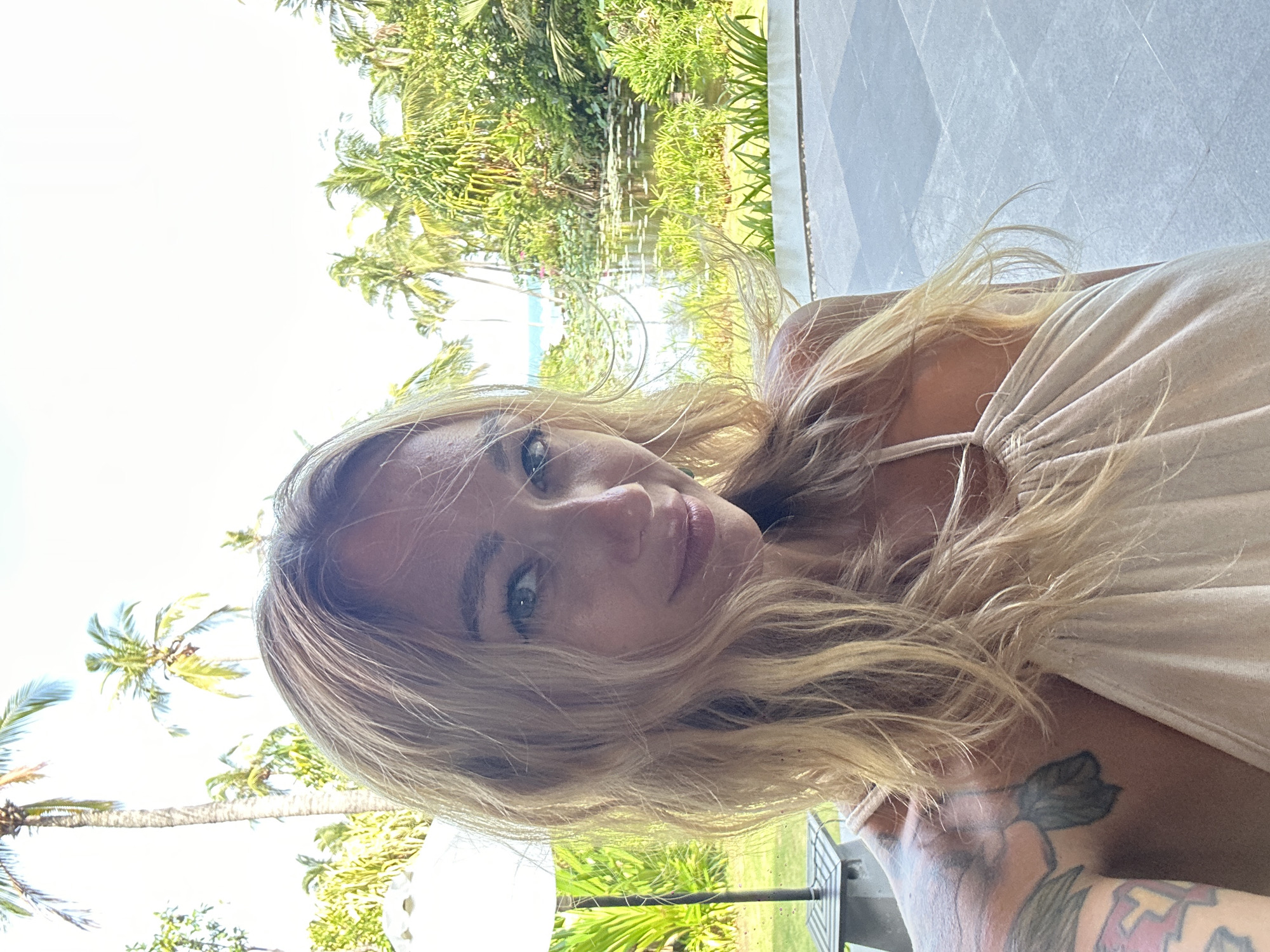 Two women take selfies at Vietnamese outdoor restaurant