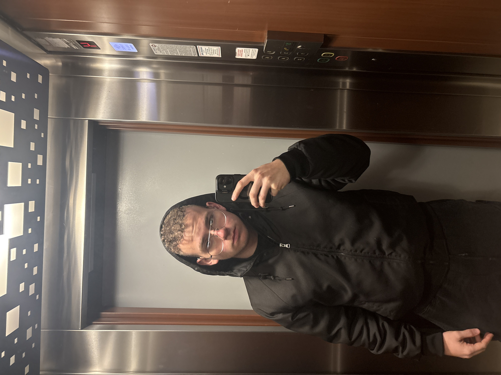 Young adult takes selfies in Plovdiv elevator
