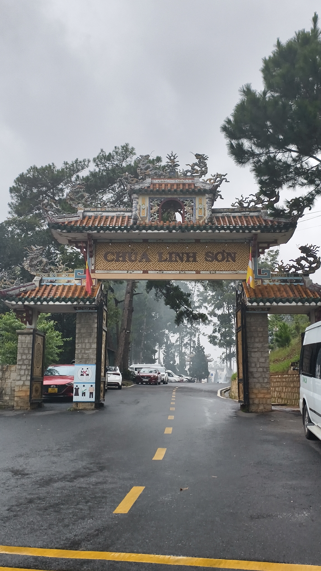Buddhist temple details in Đà Lạt: ornate gate and phoenix relief