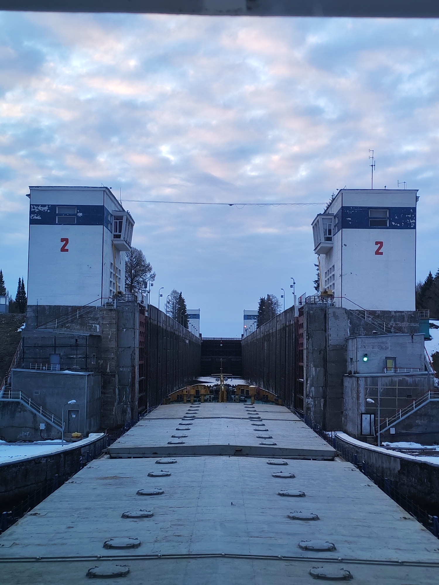 Cargo vessel transits canal lock in Ankhimovo, Russia