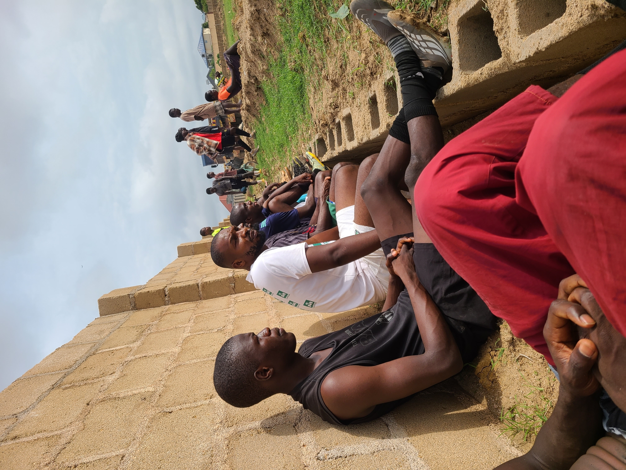 Athletes gather and rest at outdoor sports facility