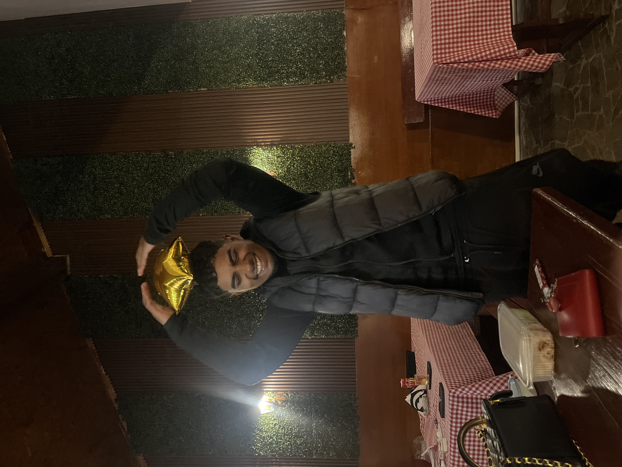 Man celebrates with gold star balloon in Bulgarian town