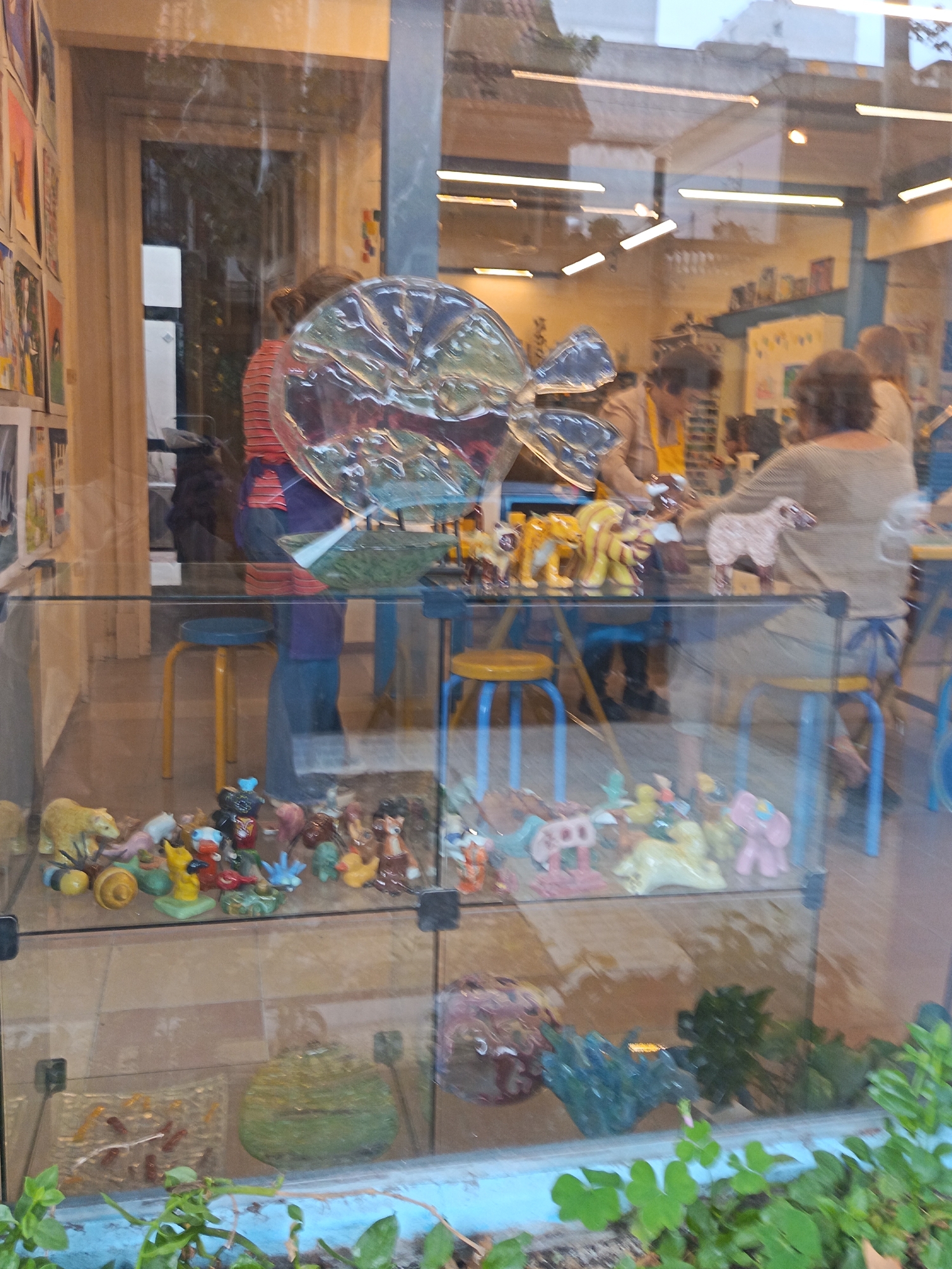 Street scenes documented in Montevideo showing ceramics shop, horse mural