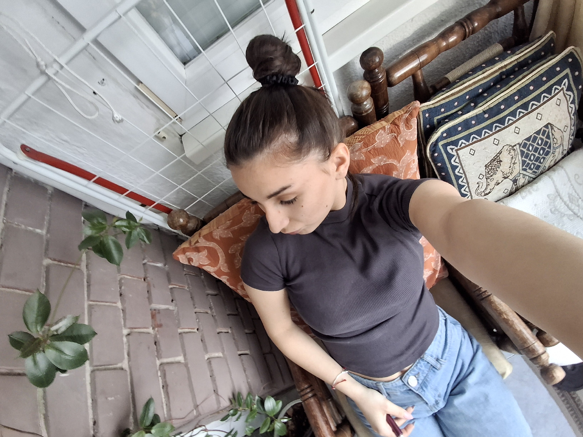 Woman captures casual moments in Sofia apartment balcony