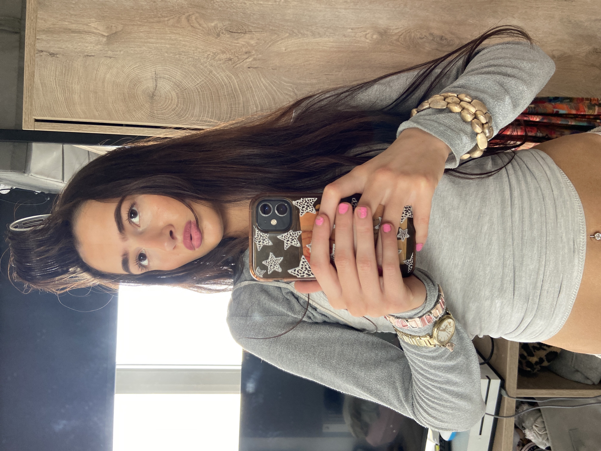 Woman takes selfies with hair roller in London