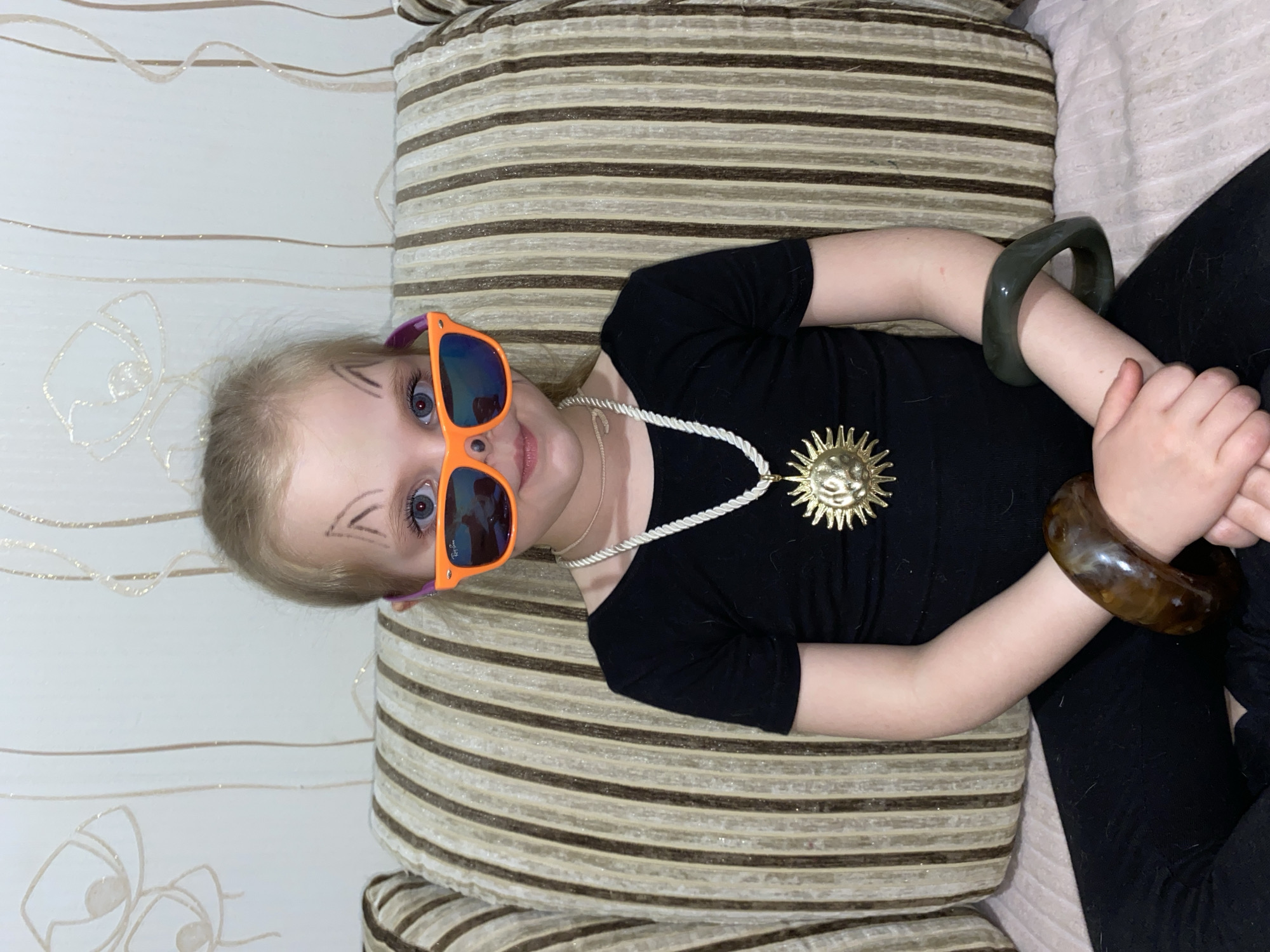 Child and puppy share playful moments in Votkinsk home
