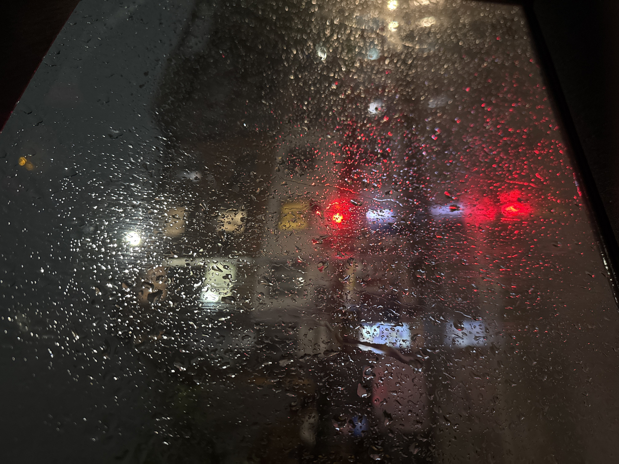 Rainy evening observed through window in Haskovo, Bulgaria