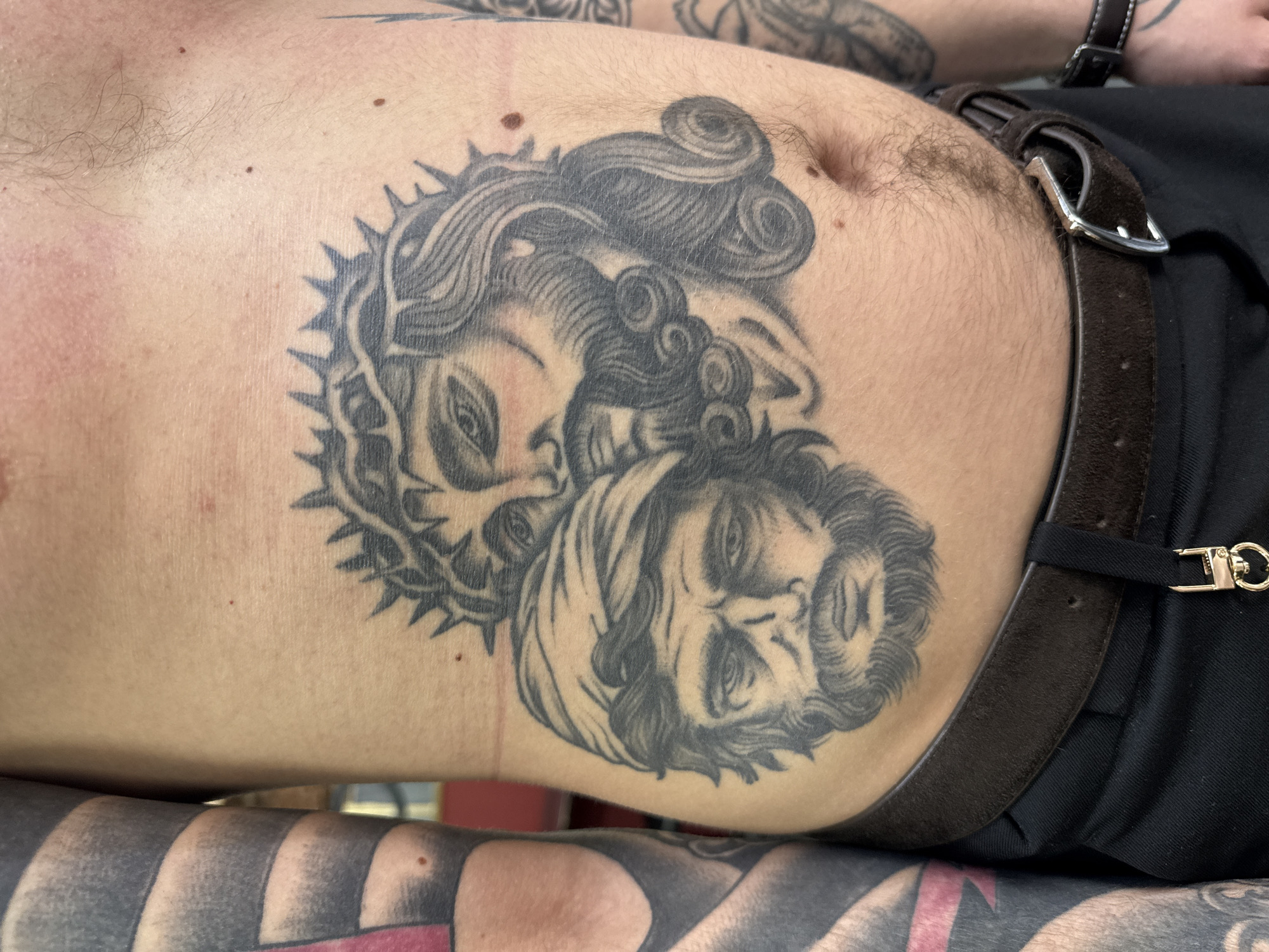 Detailed tattoo artwork photographed on person's torso in Moscow