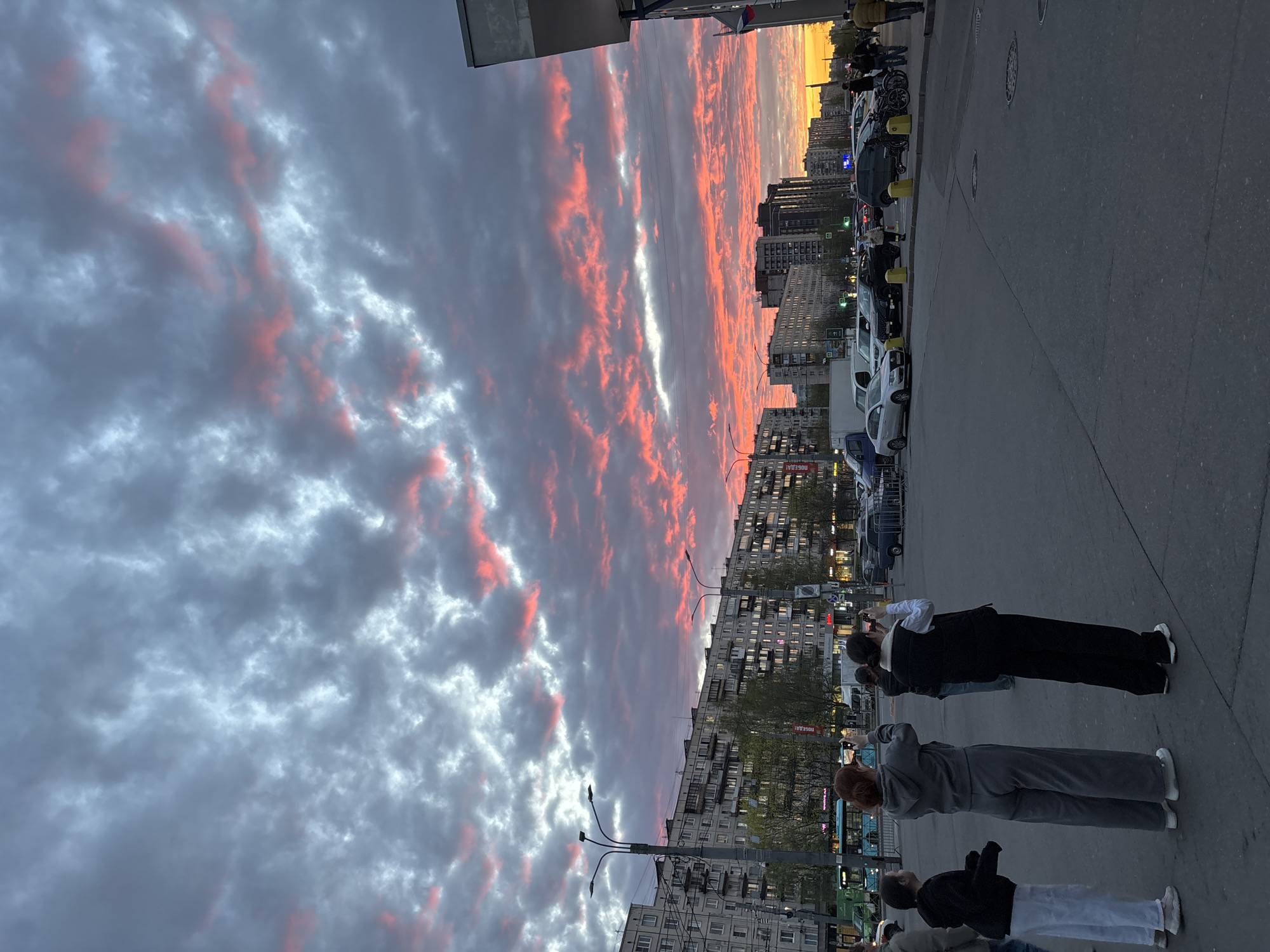 Sunset illuminates Saint Petersburg streets with parked electric scooters