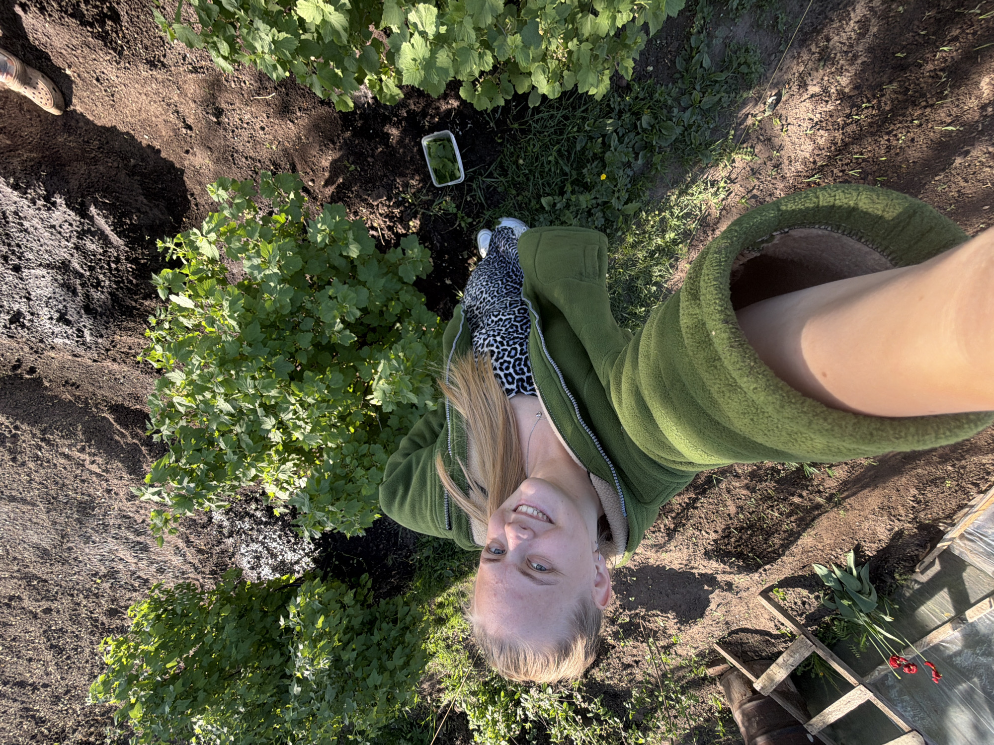 Woman gardens and takes selfies in Chaikovsky, Russia
