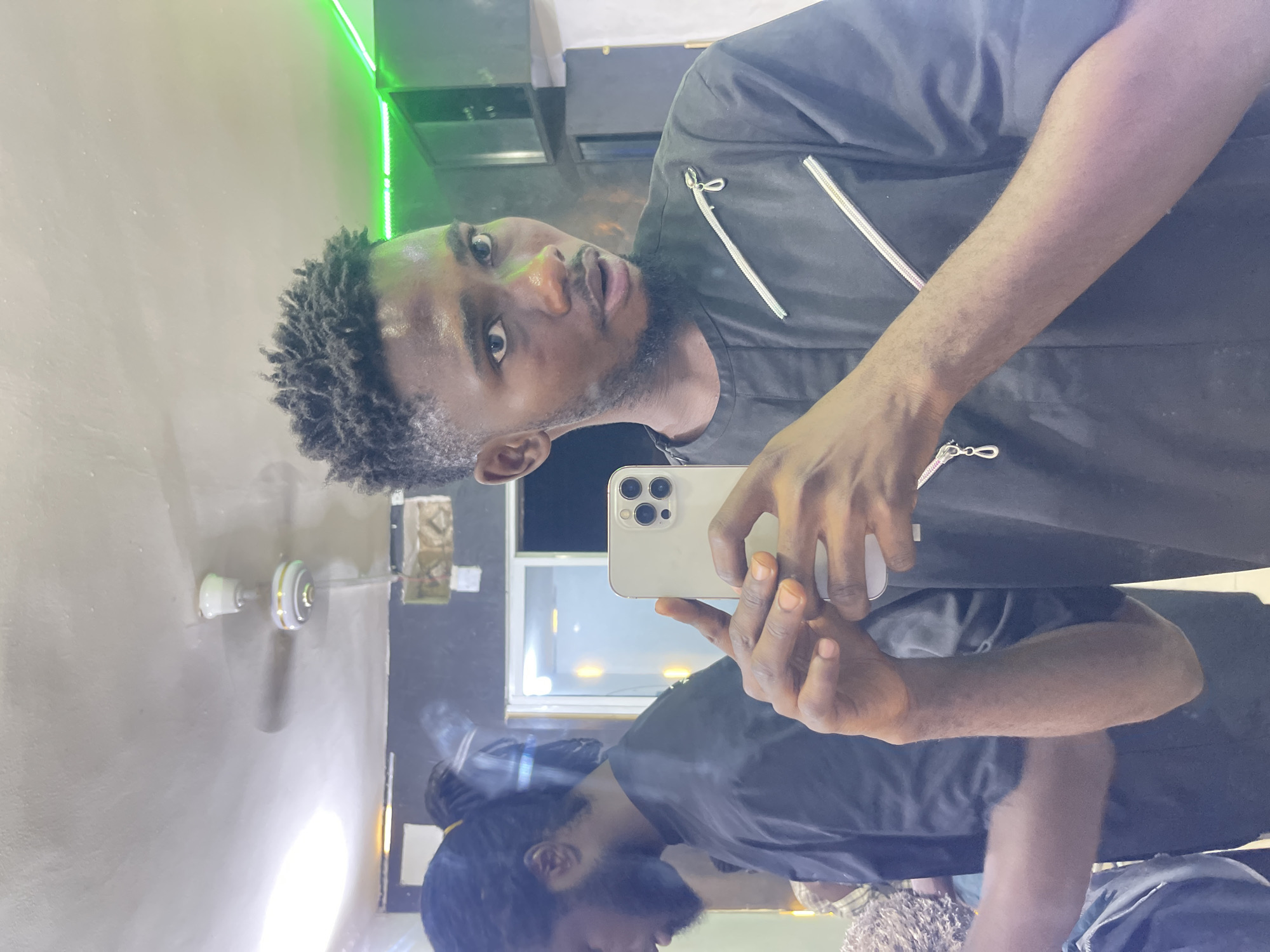 Evening barbershop and recreation scenes documented in Nigerian neighborhood