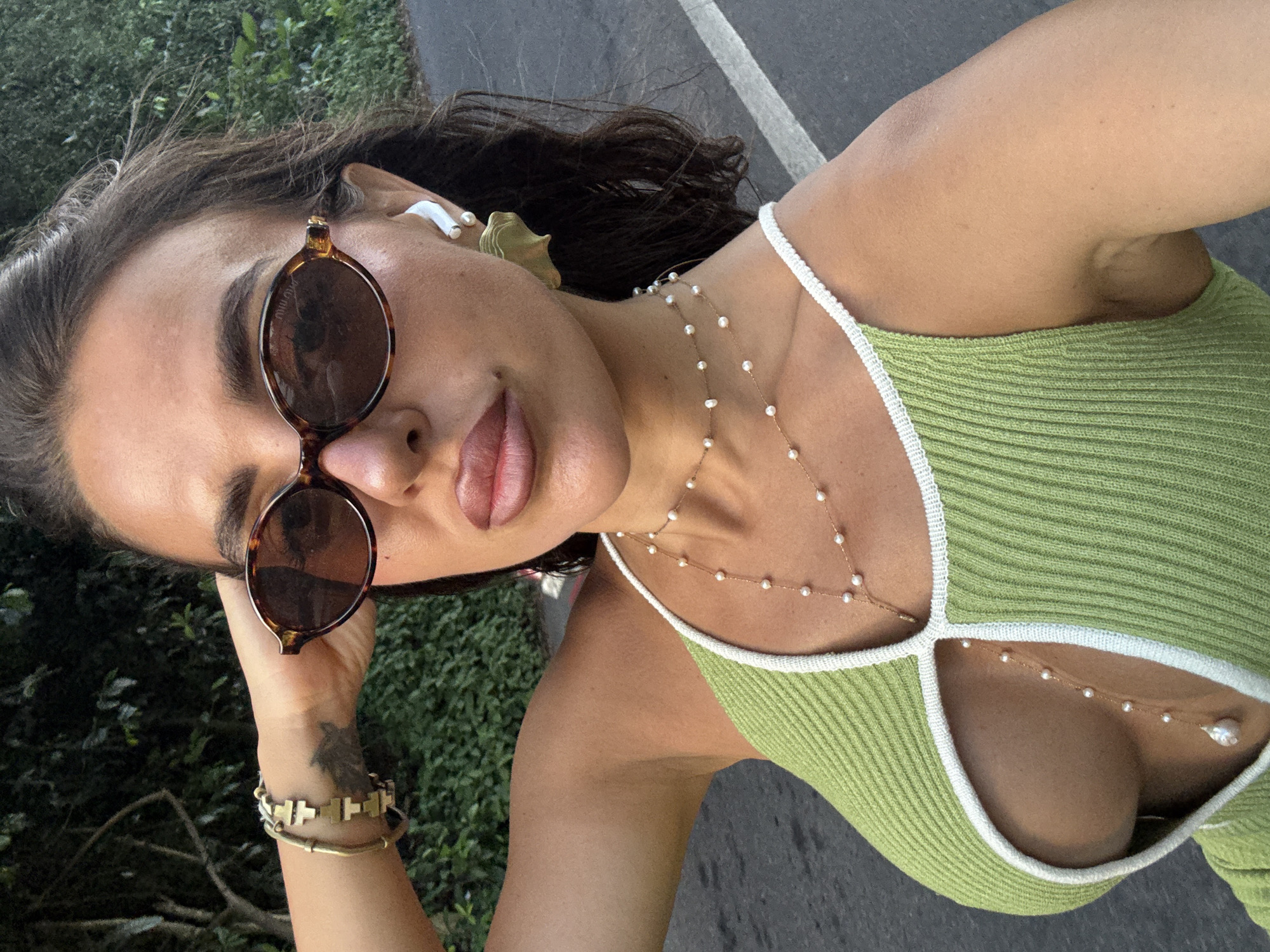 Woman takes selfies while cycling in Kuta Selatan