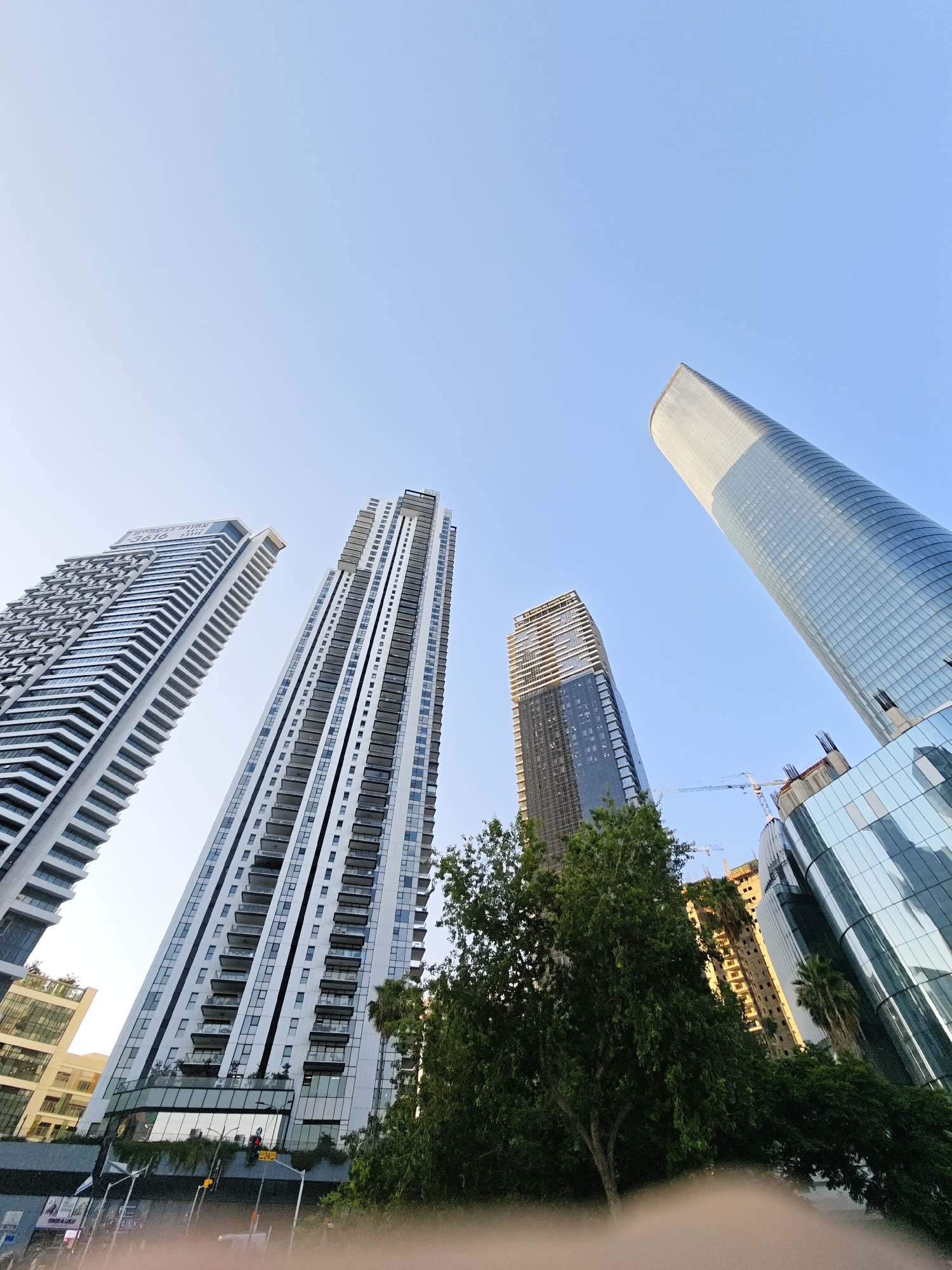 Looking up at Tel Aviv–Givatayim's modern high-rise skyline