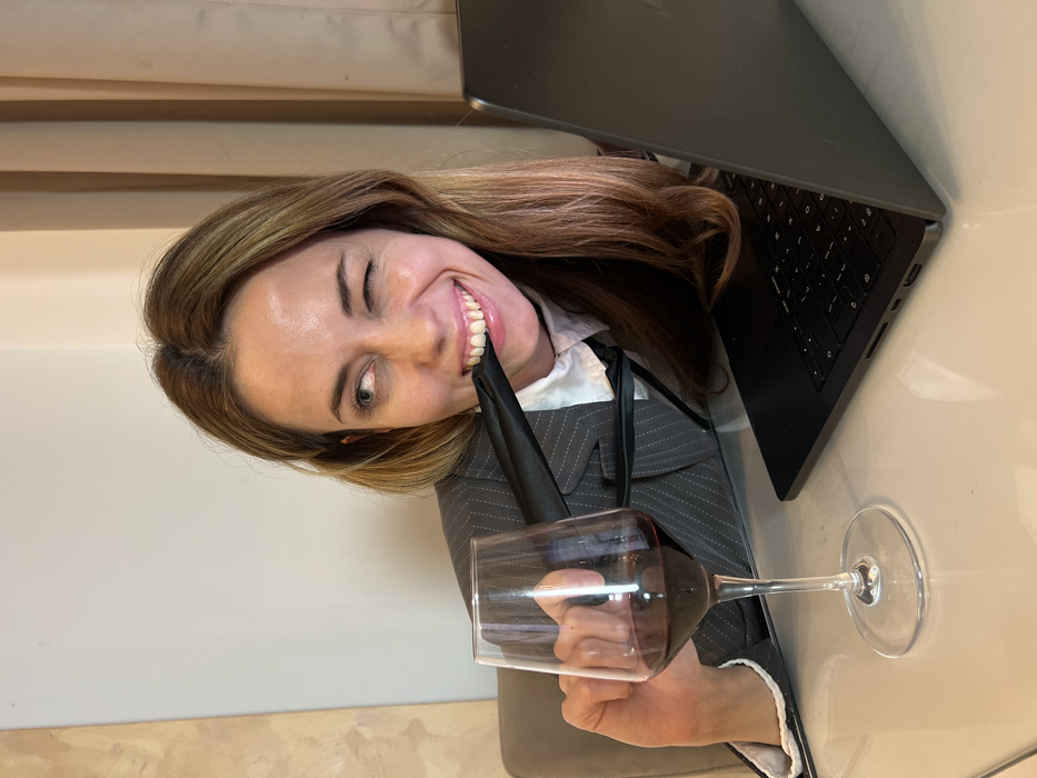 Woman works, poses with wine at Montenegro location