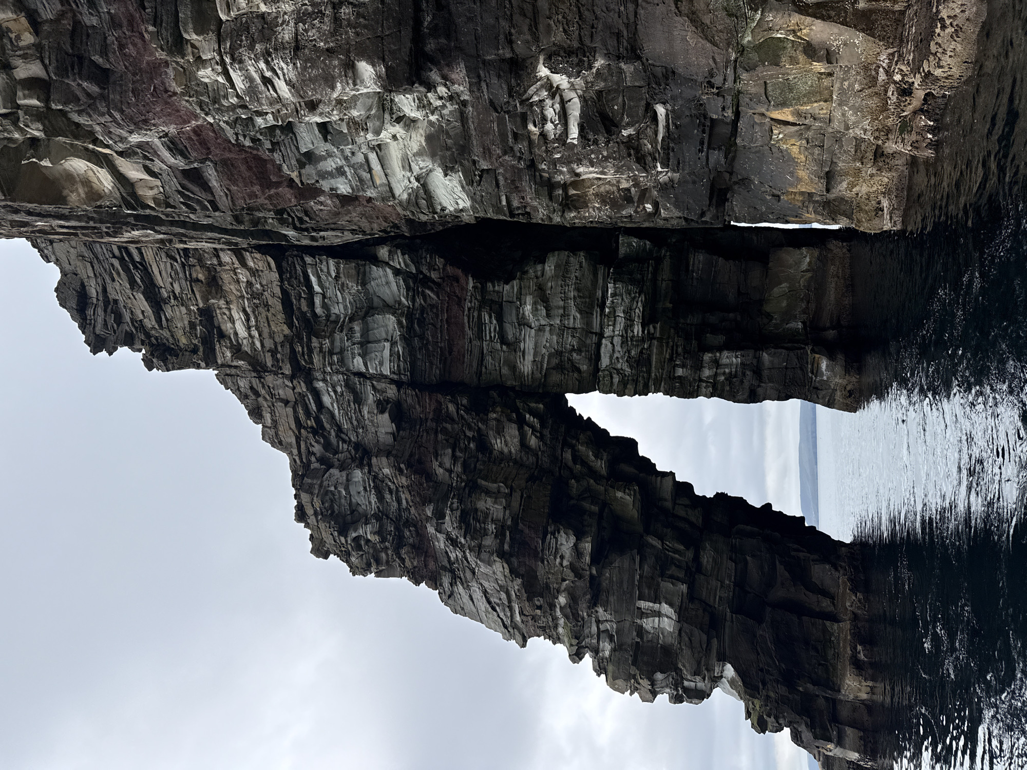Shetland sea stacks, arches, and stratified cliffs up close