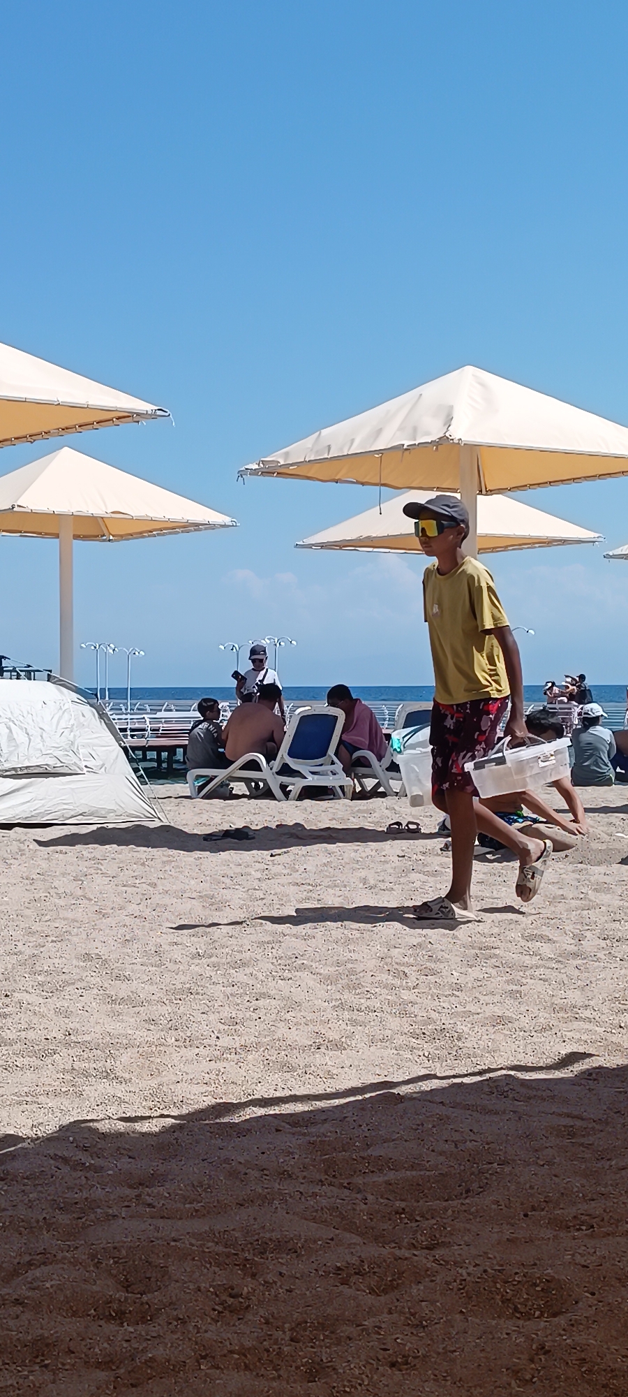 Sun, sea, and activity across a busy coastal day