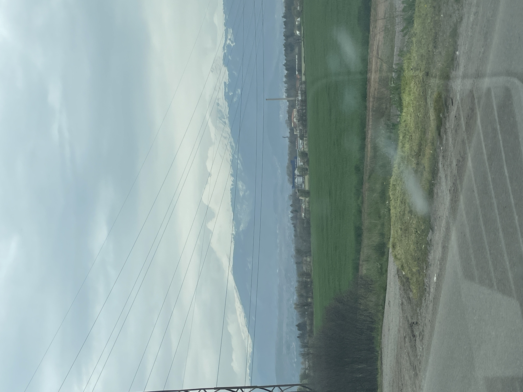 Overcast skies and snow-capped peaks observed near Kazichene, Bulgaria