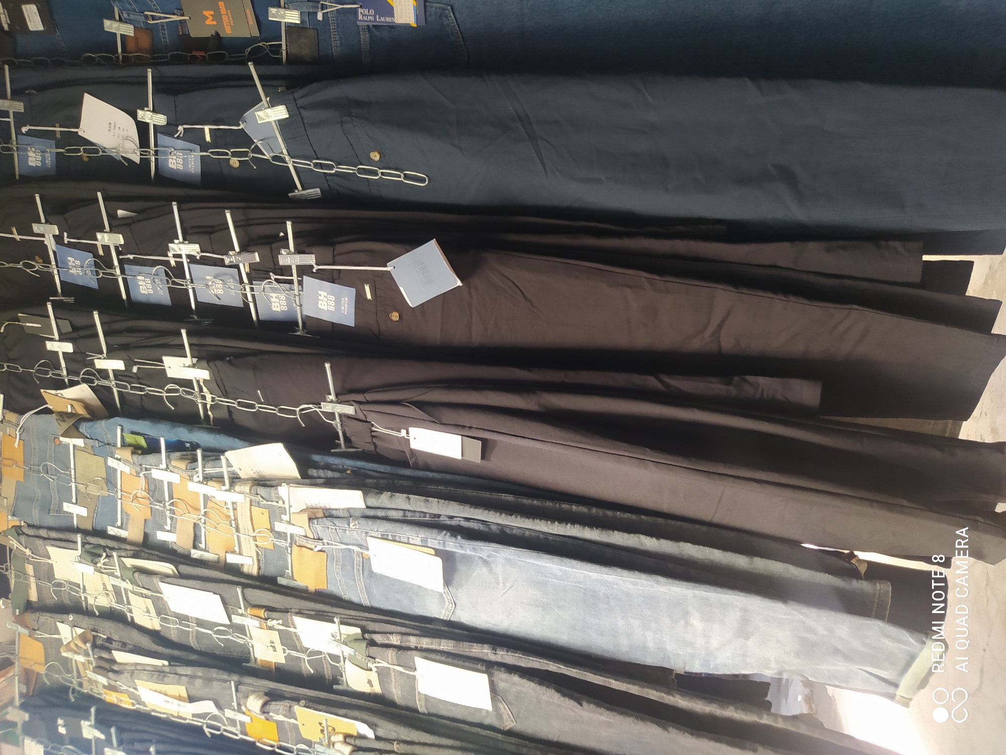 Denim jeans on display at a Karakol clothing stall