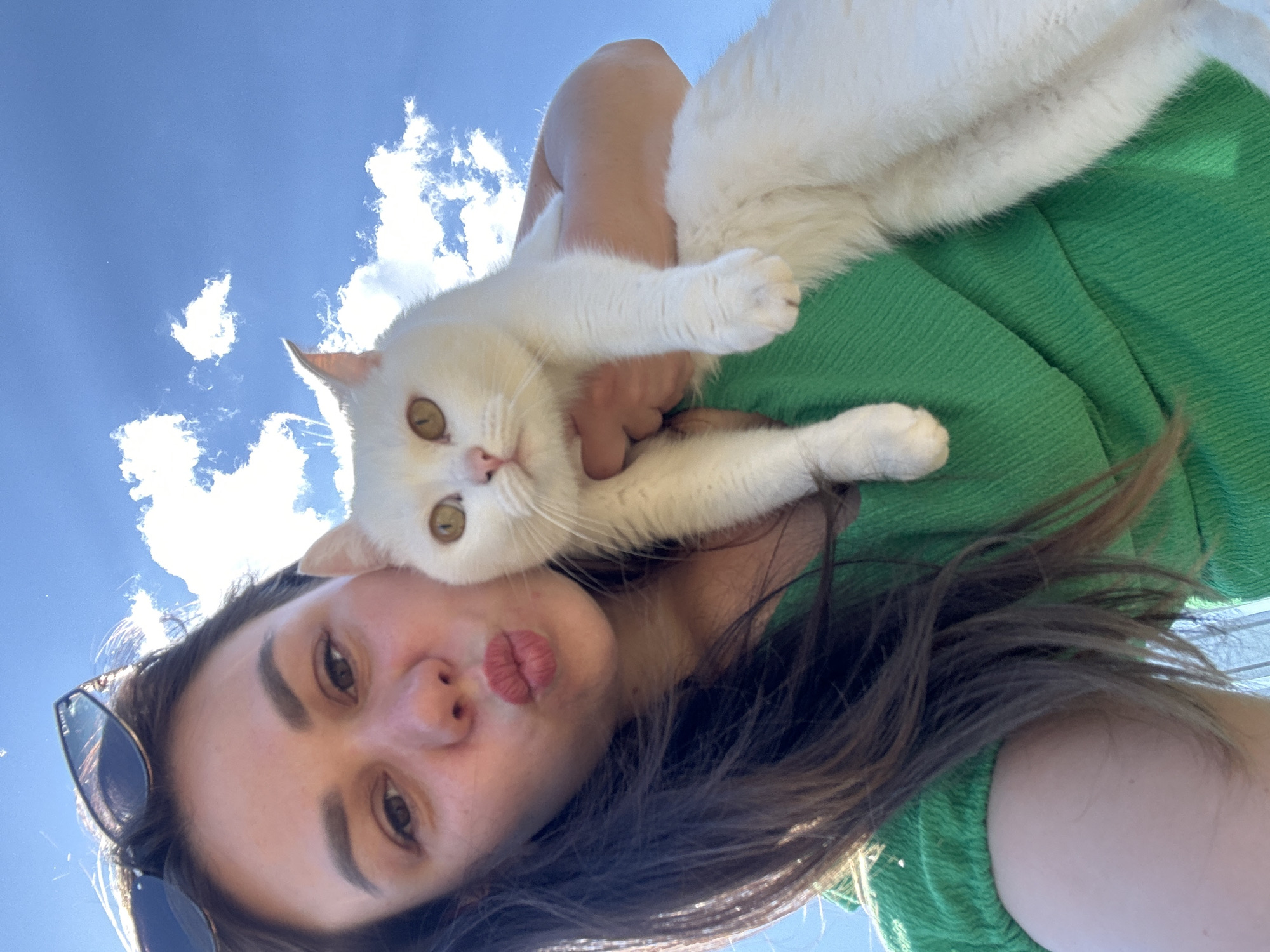 Woman and white cat share quiet morning moment in Chaikovsky