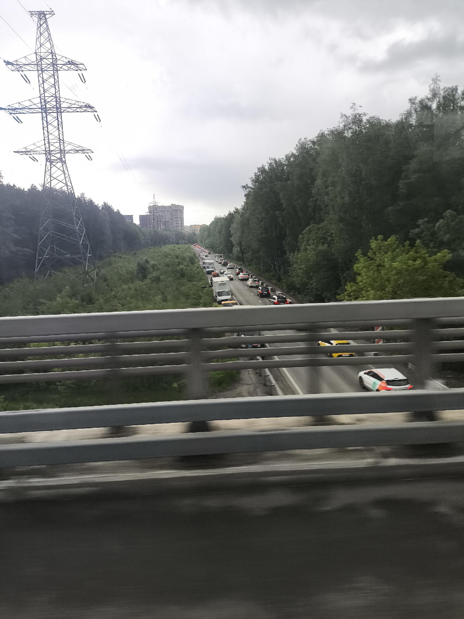 Urban infrastructure observed across metro area under stormy skies