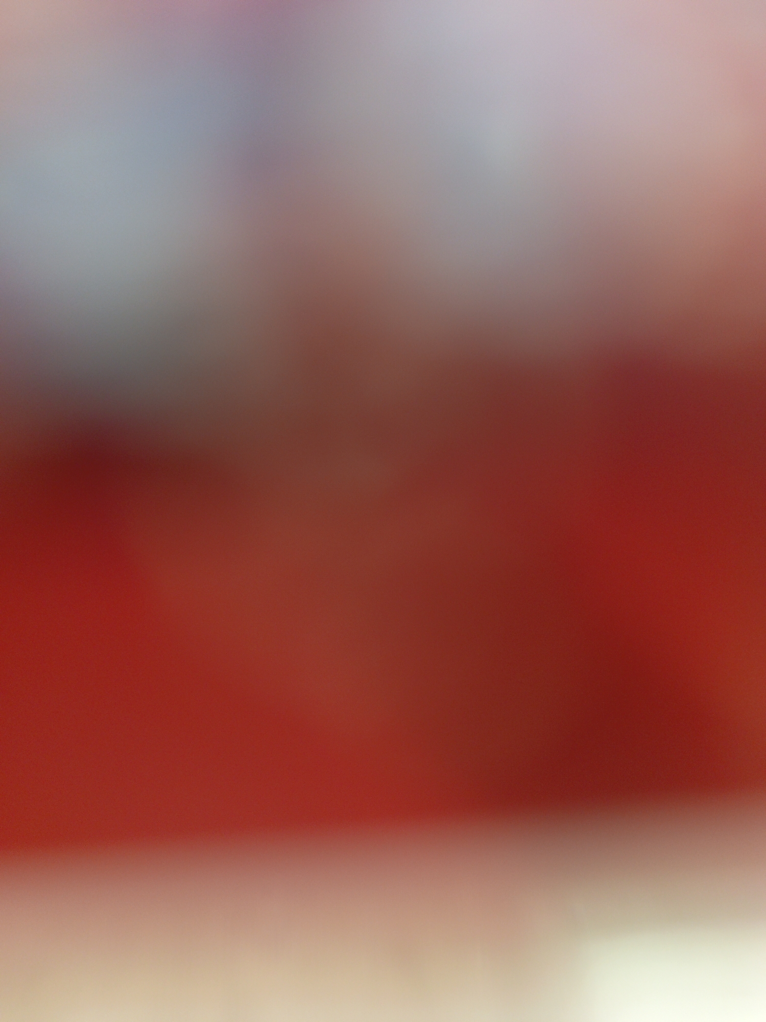 Blurred images show red tones, light source, plaid fabric