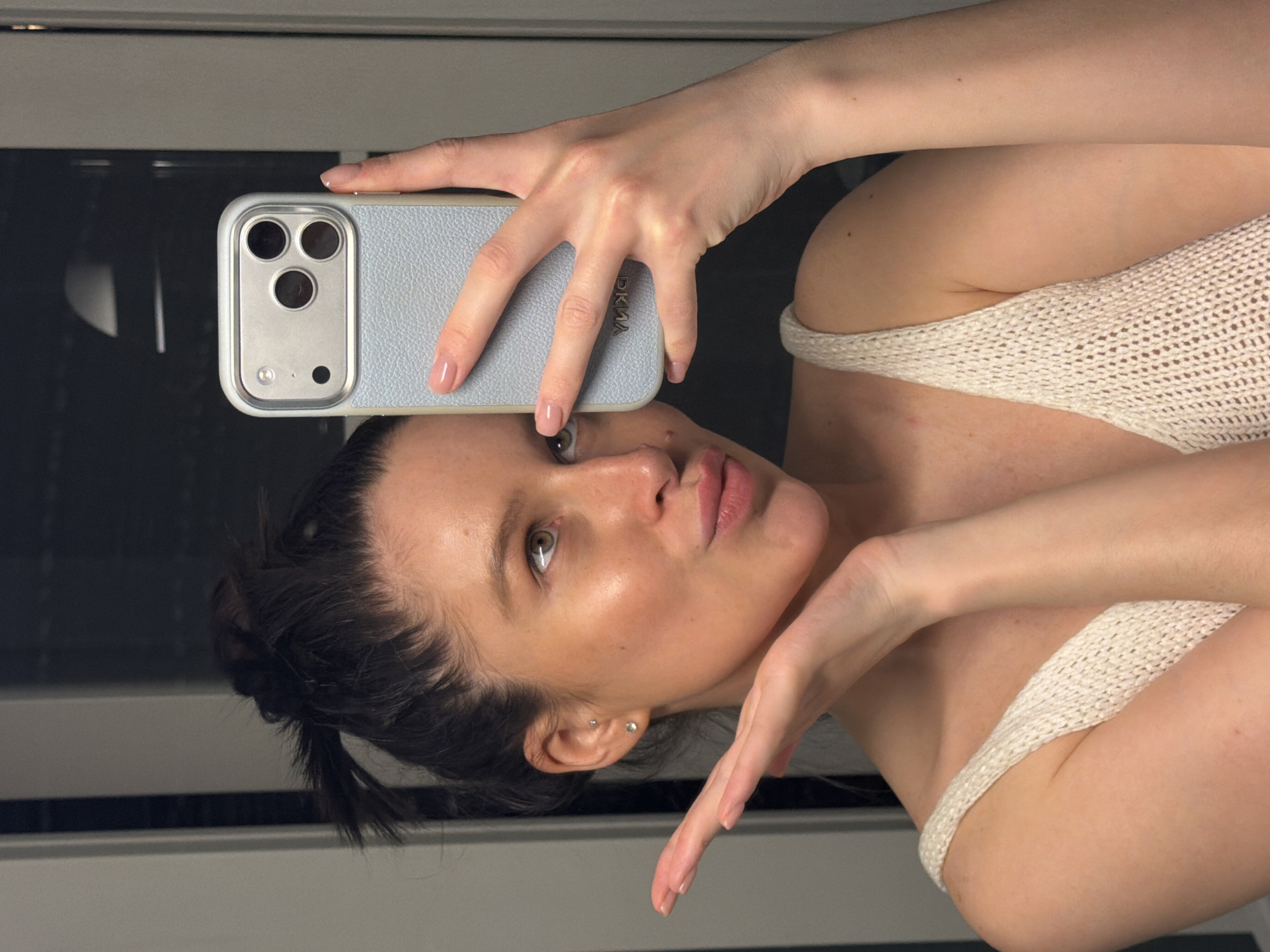 Woman takes mirror selfie in Khimki, Russia