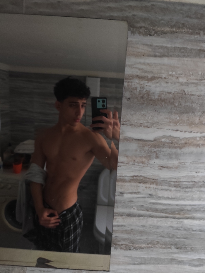 Young man takes multiple bathroom mirror selfies in Damascus area