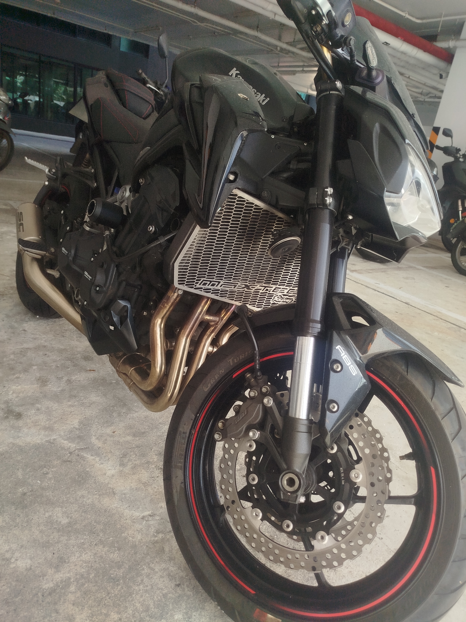 Kawasaki Z900 and Honda CBR 650R parked in Kathu garage