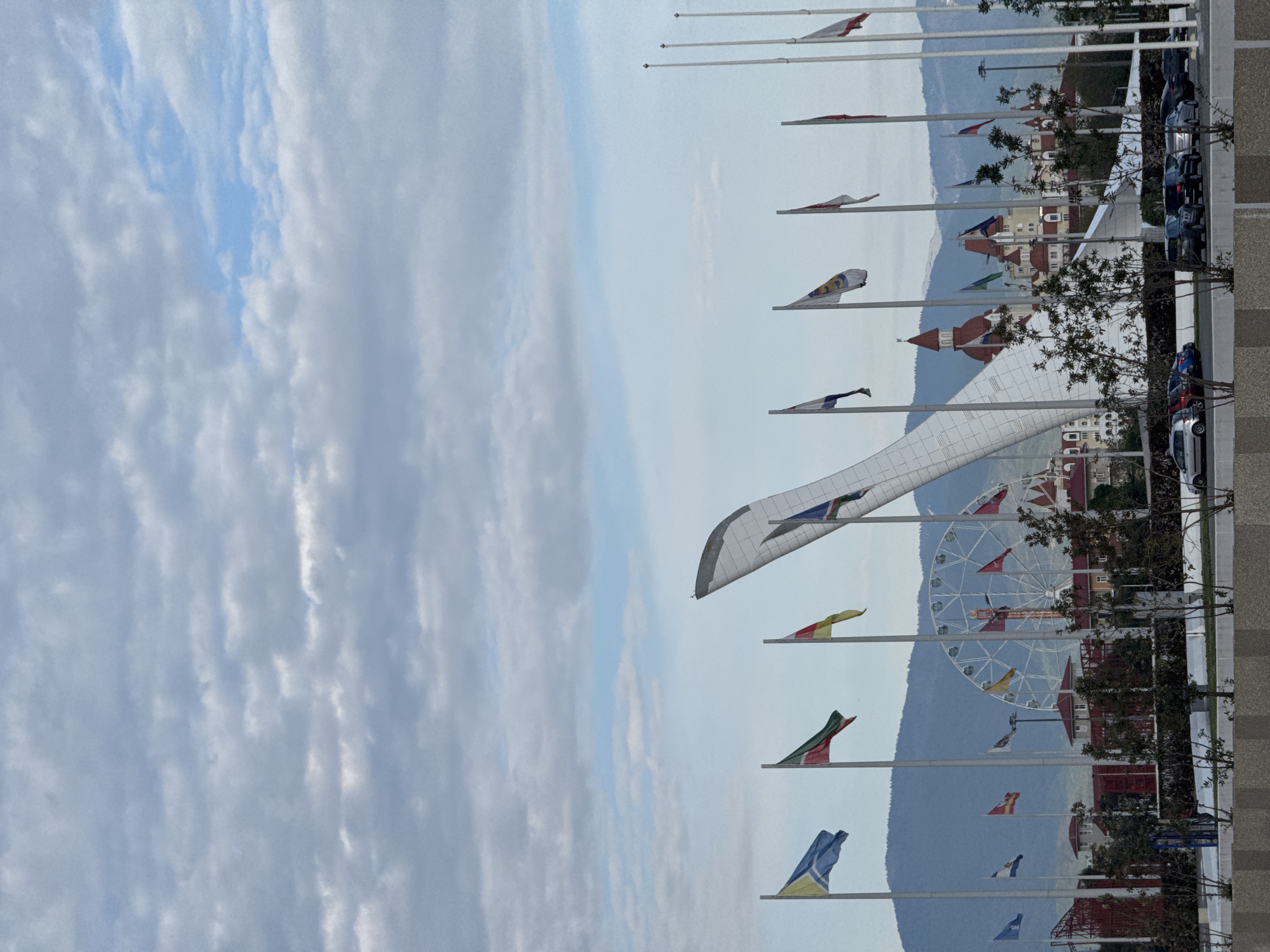 Flags wave at mountainous display in Sirius, Russia