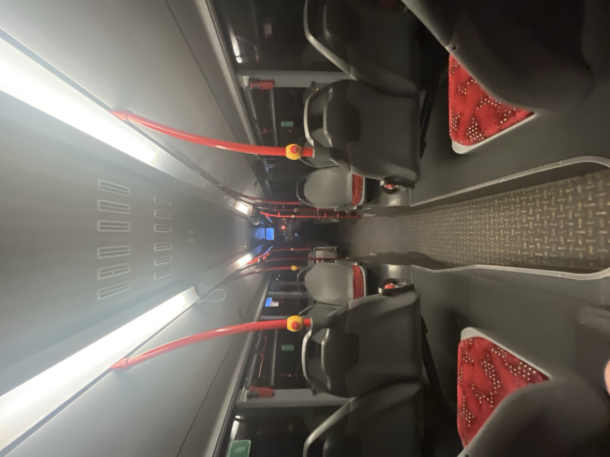 Man with mobile phone rides public bus in Gelsenkirchen