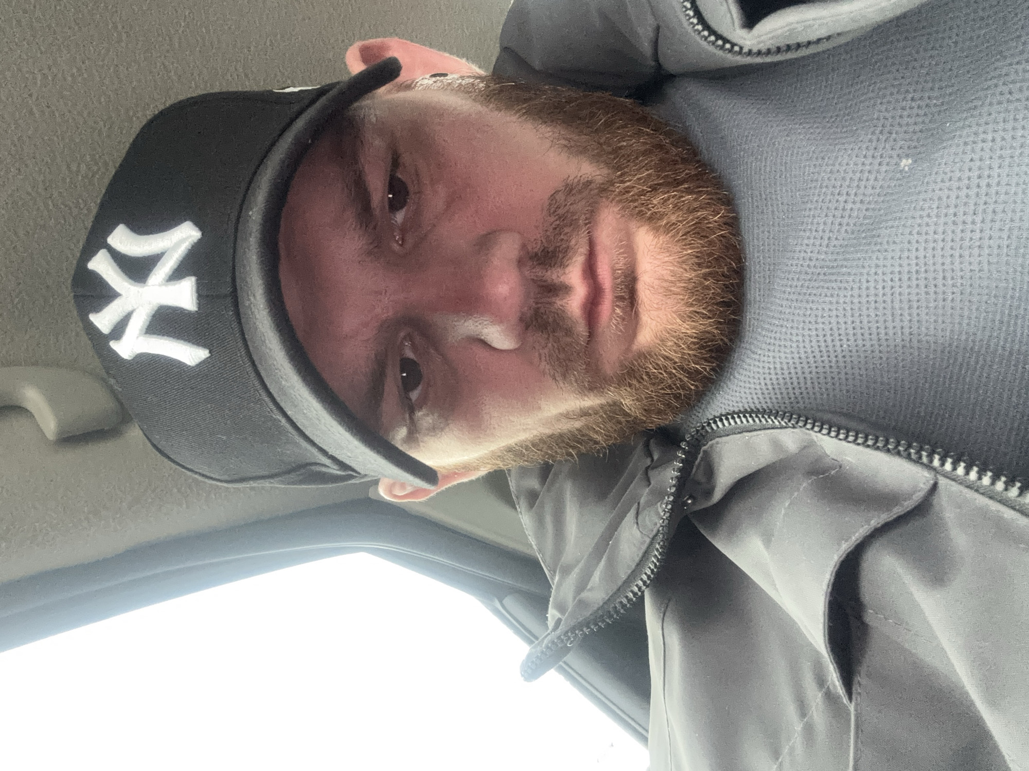 Man in NY cap photographed in vehicle in Perm