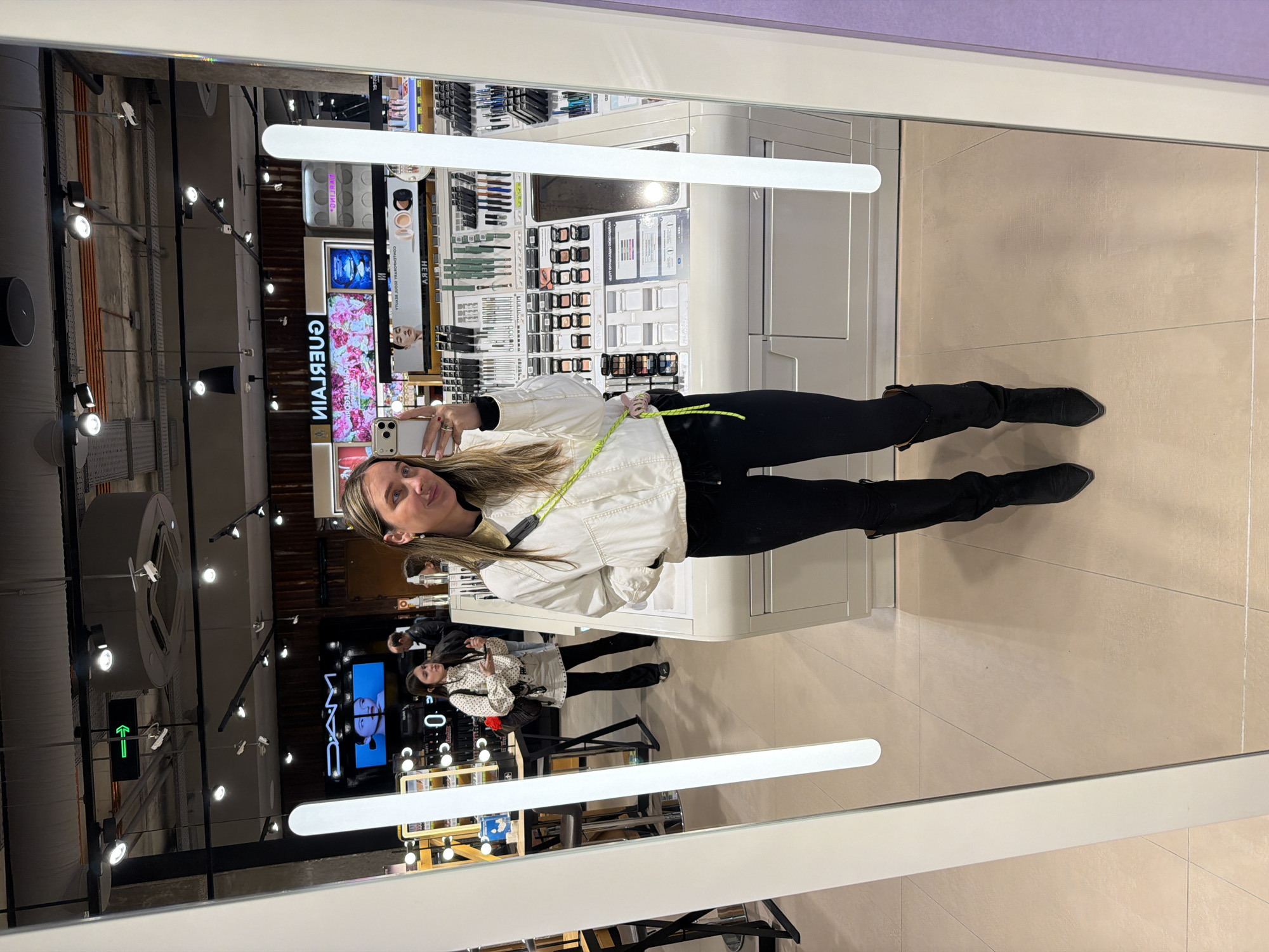 Woman takes selfies at Moscow cosmetics store
