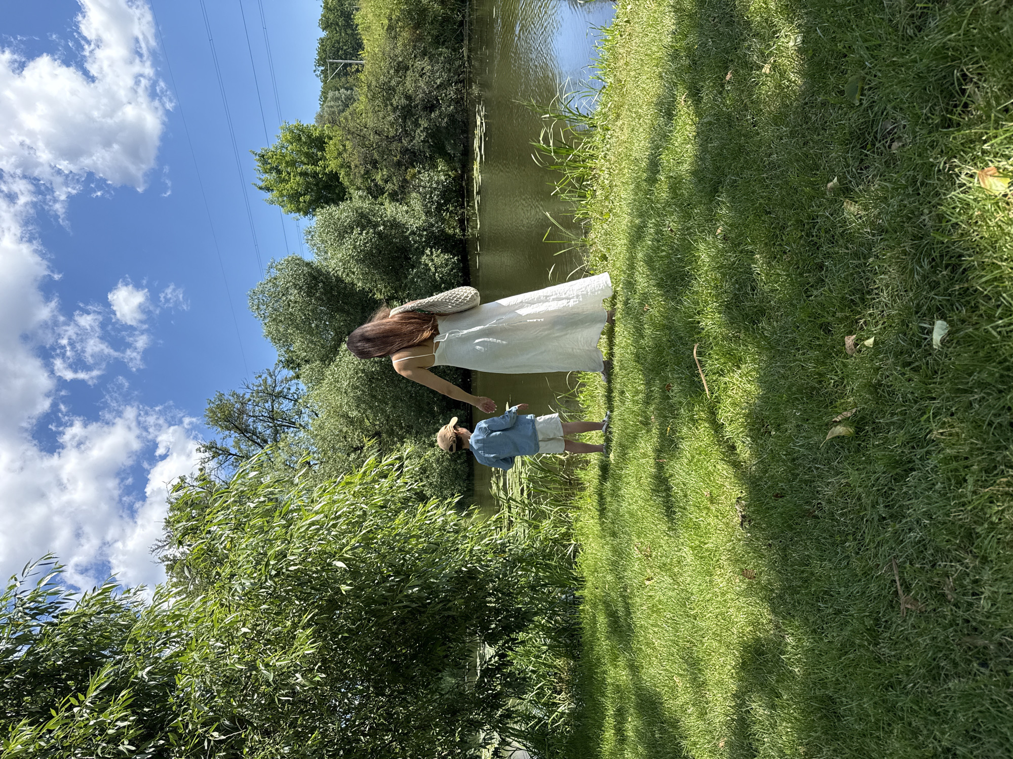 Park picnic with rosé, snacks, and sunny waterside vibes