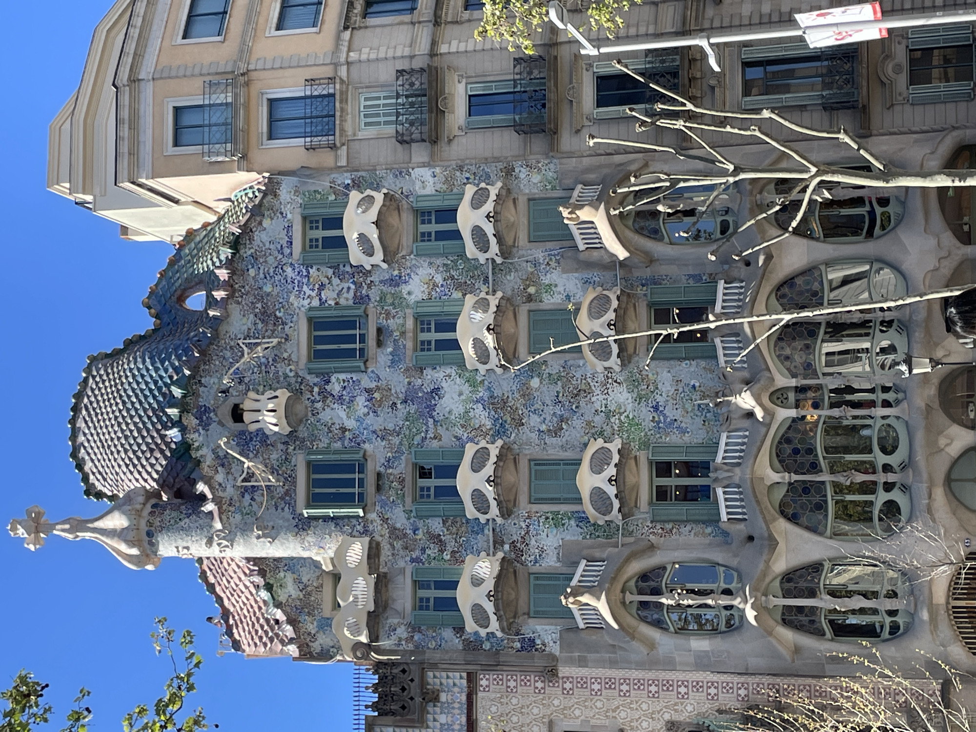 Tourists document iconic Gaudí building Casa Batlló in Barcelona