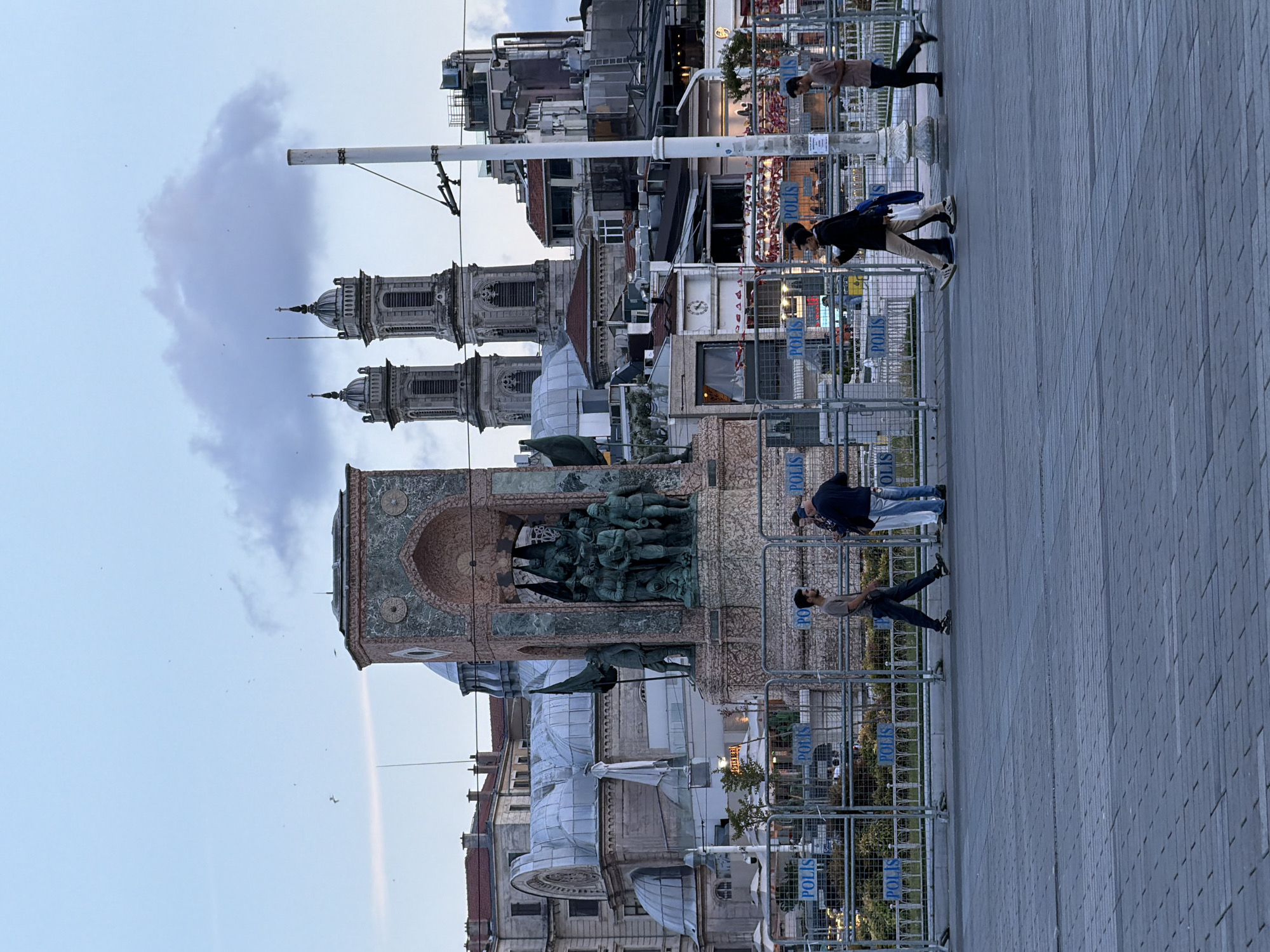 Evening scenes captured at Istanbul's Taksim Square with police presence