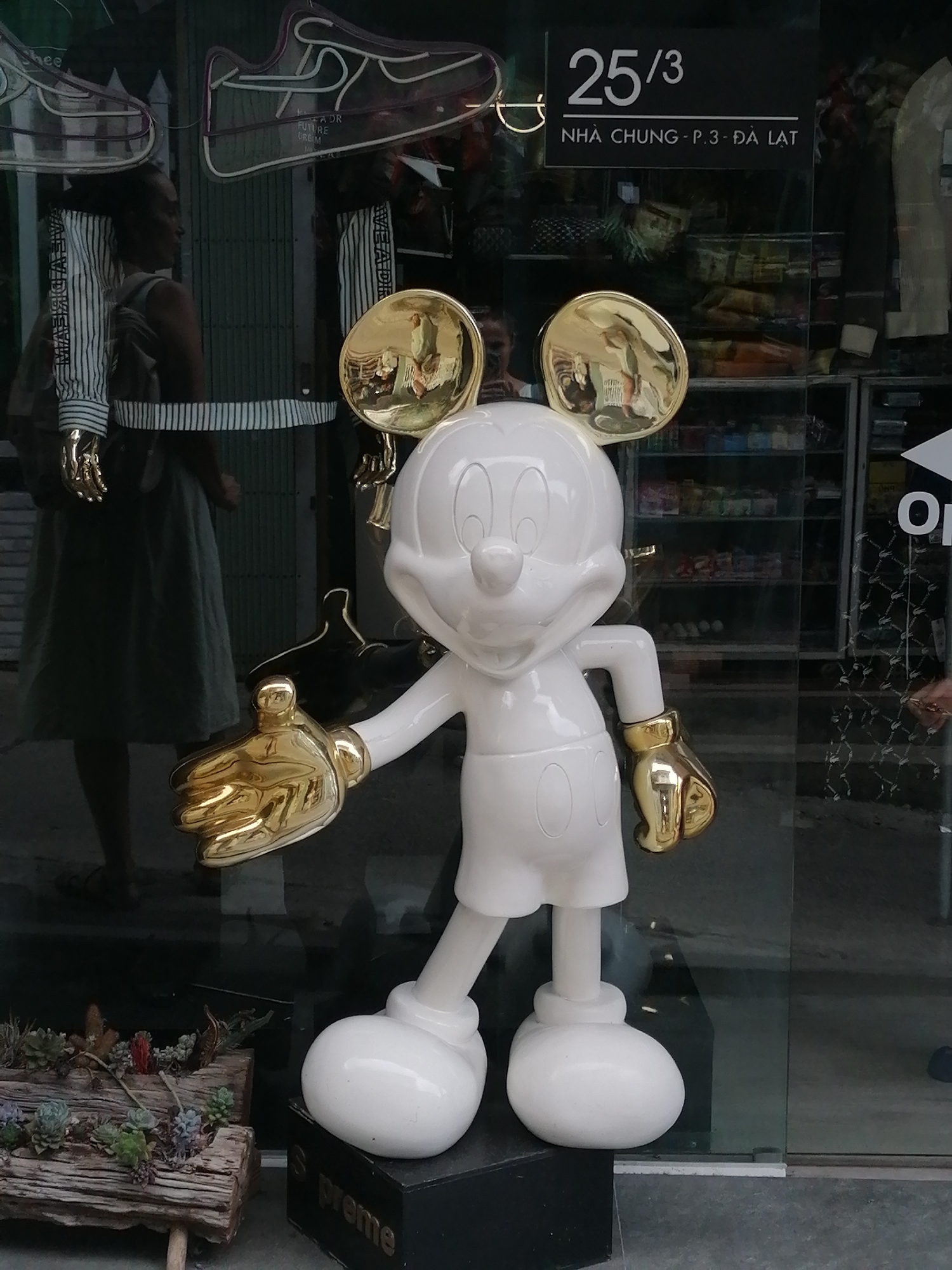 Mickey Mouse statue displayed outside Da Lat shop